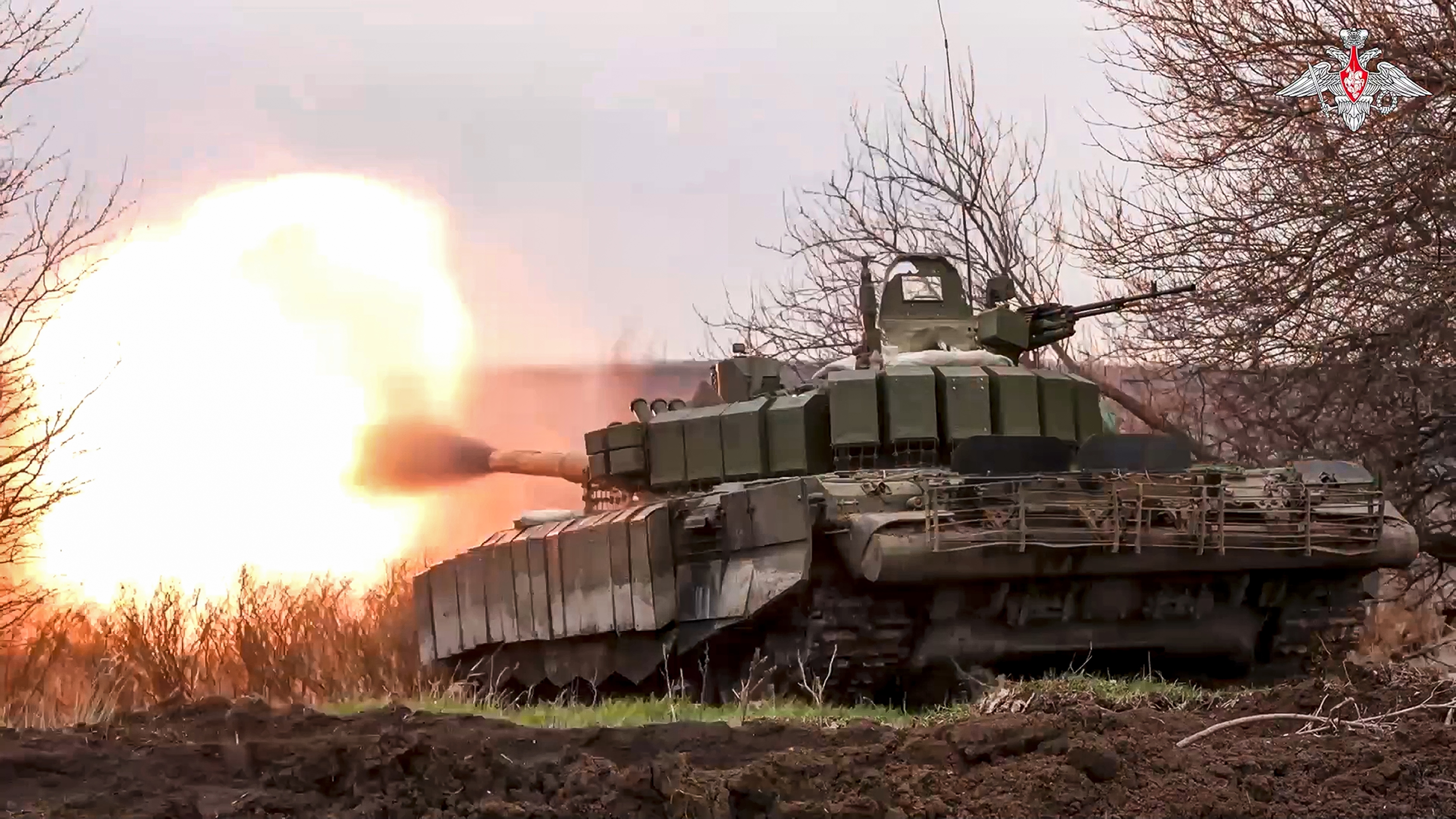 FILE - In this photo released by the Russian Defense Ministry Press Service on Tuesday, March 19, 2024, a Russian tank fires at Ukrainian troops from a position near the border with Ukraine in the Belgorod region of Russia. The Russian military says it has inflicted massive losses to Ukrainian forces who have launched cross-border raids into the region. (Russian Defense Ministry Press Service via AP, File)