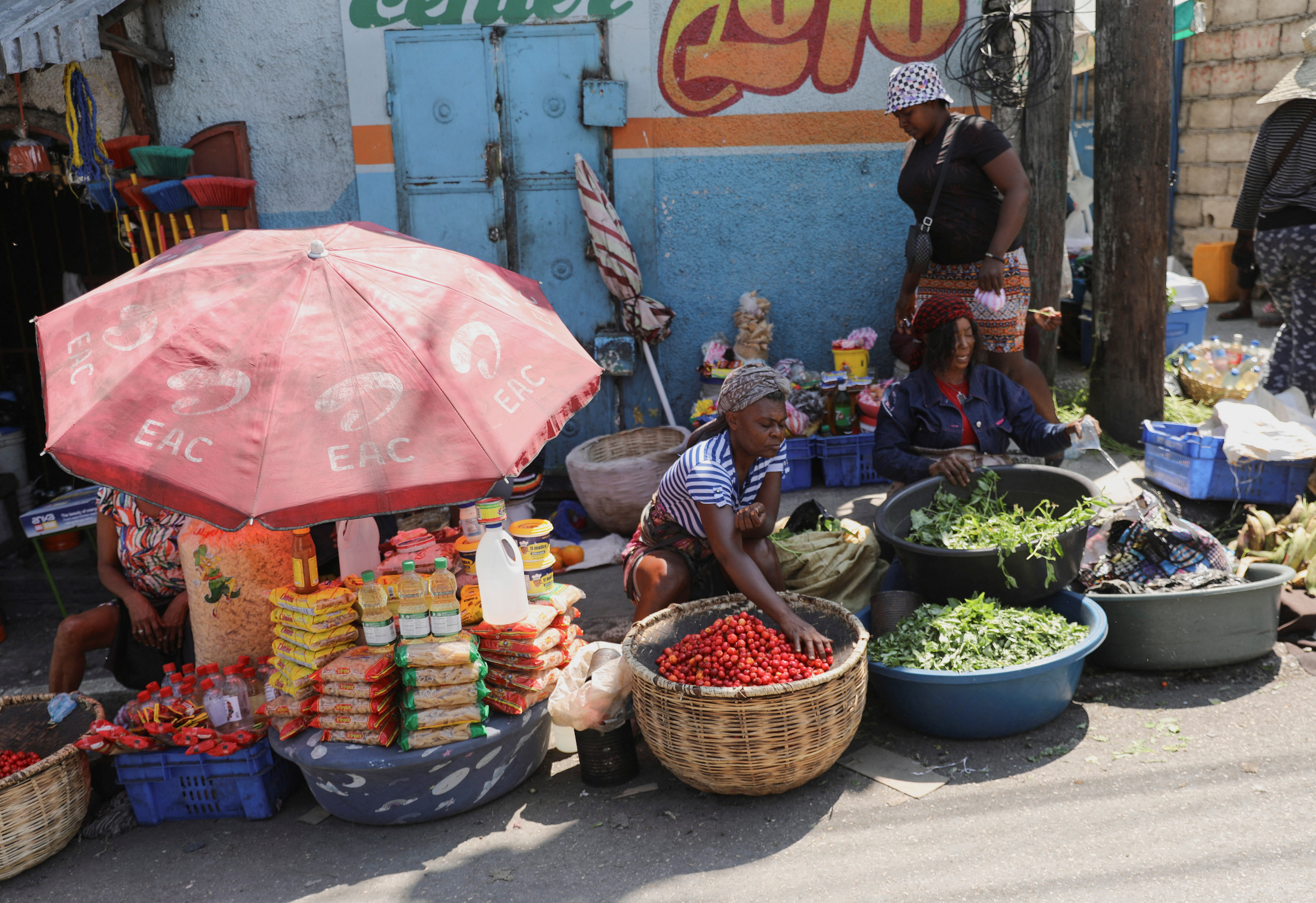 Street vendors offer produce at a market after Haiti's Prime Minister Ariel Henry pledged to step down after months of escalating gang violence, in Port-au-Prince, Haiti March 12, 2024. REUTERS/Ralph Tedy Erol