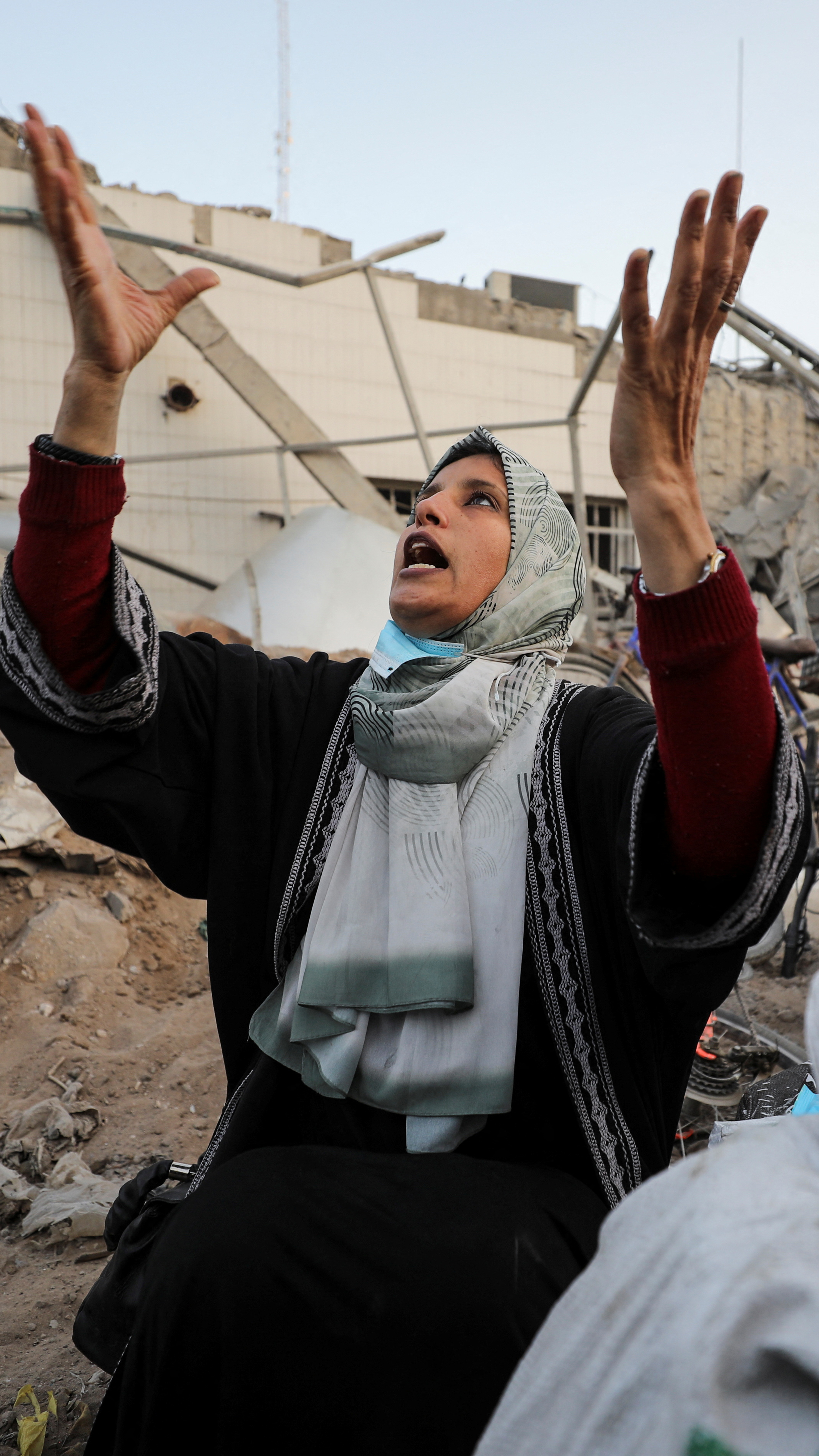 A woman reacts as she inspects damage at al-Shifa Hospital in Gaza City, April 1