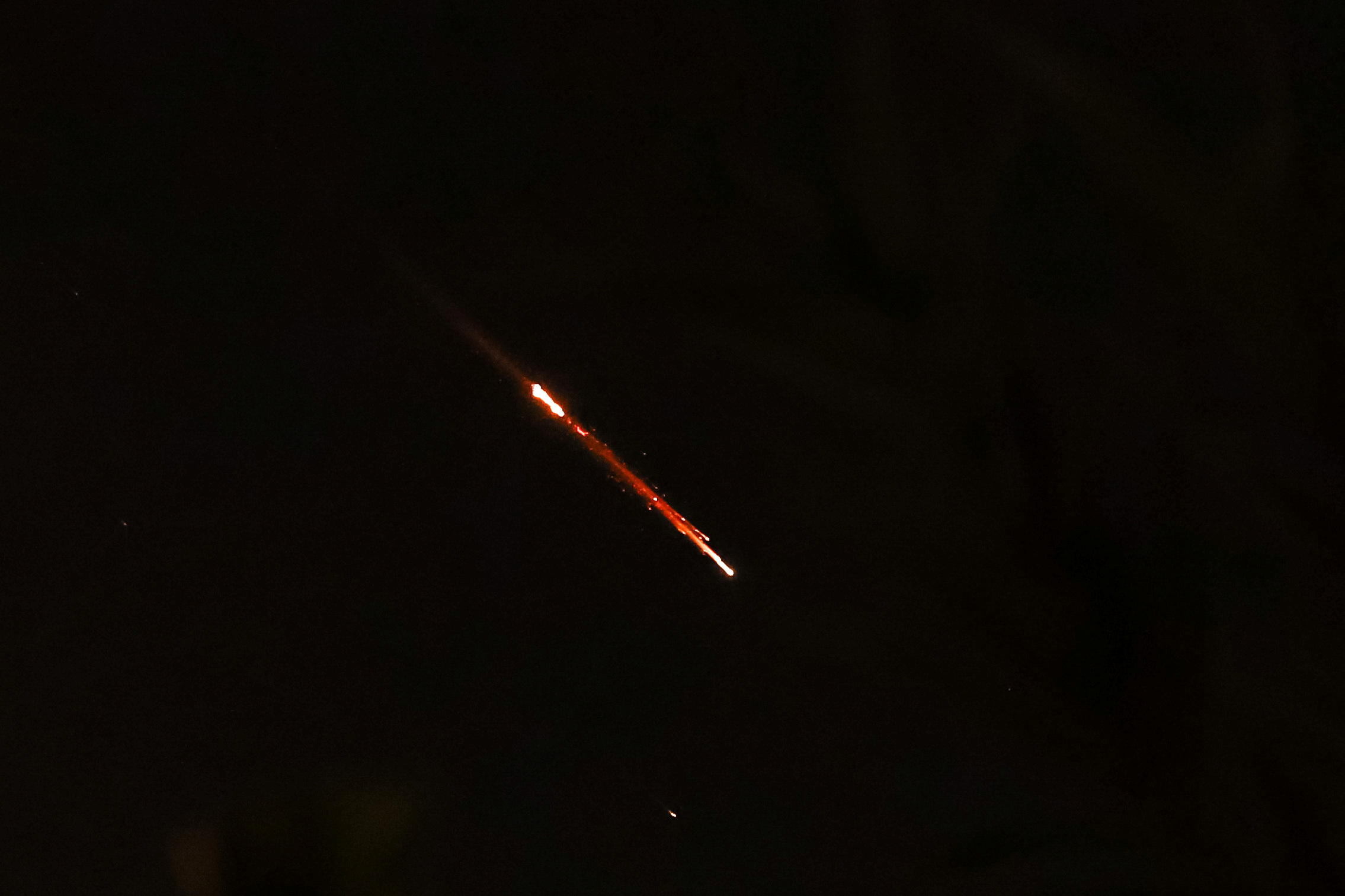 Objects are seen in the sky above Jerusalem after Iran launched drones and missiles towards Israel, in Jerusalem April 14, 2024.