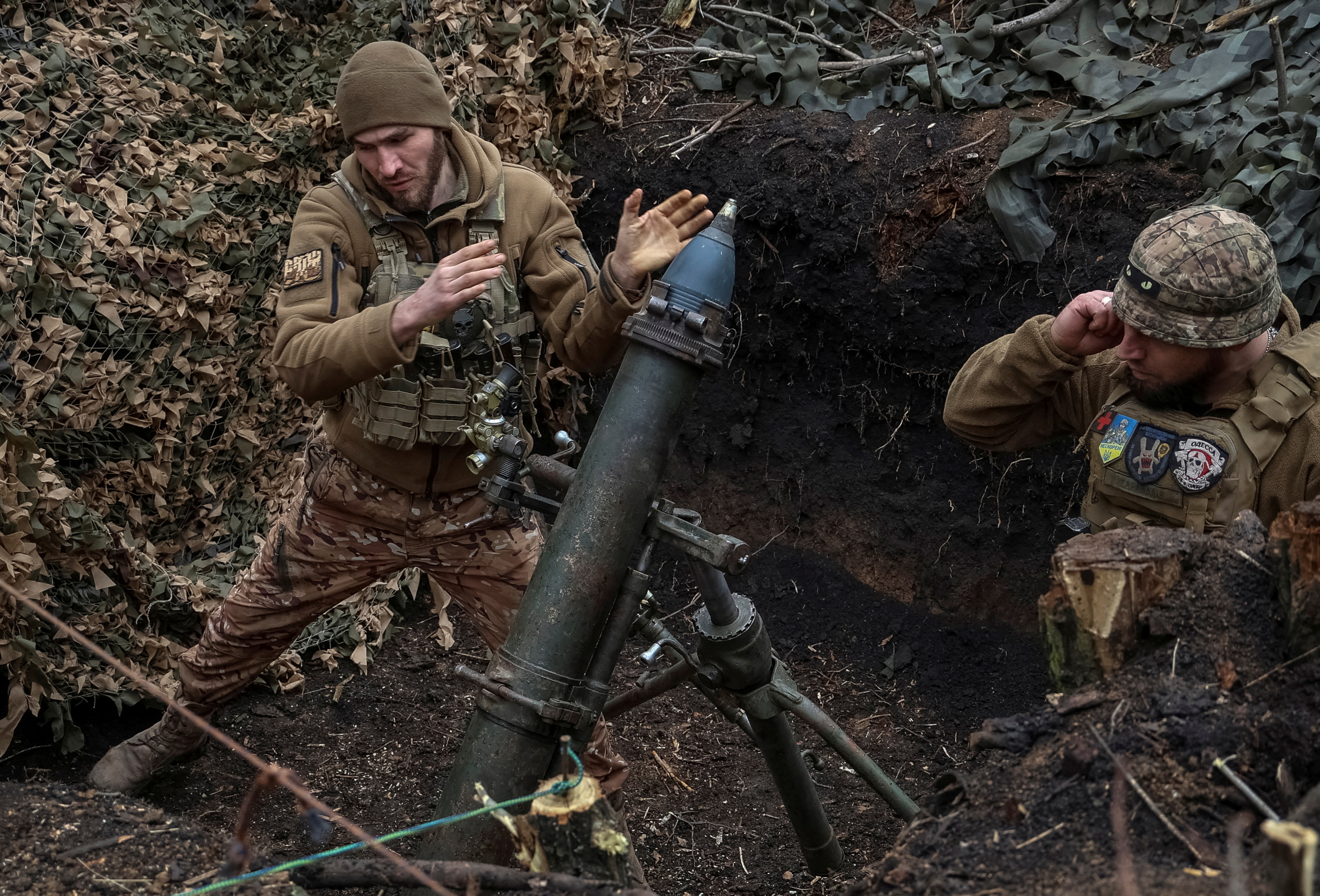 Ukrainian servicemen of the 28th Separate Mechanised Brigade fire a 120mm mortar towards Russian troops amid Russia’s attack on Ukraine, near the town of Bakhmut, Ukraine, on March 15, 2024