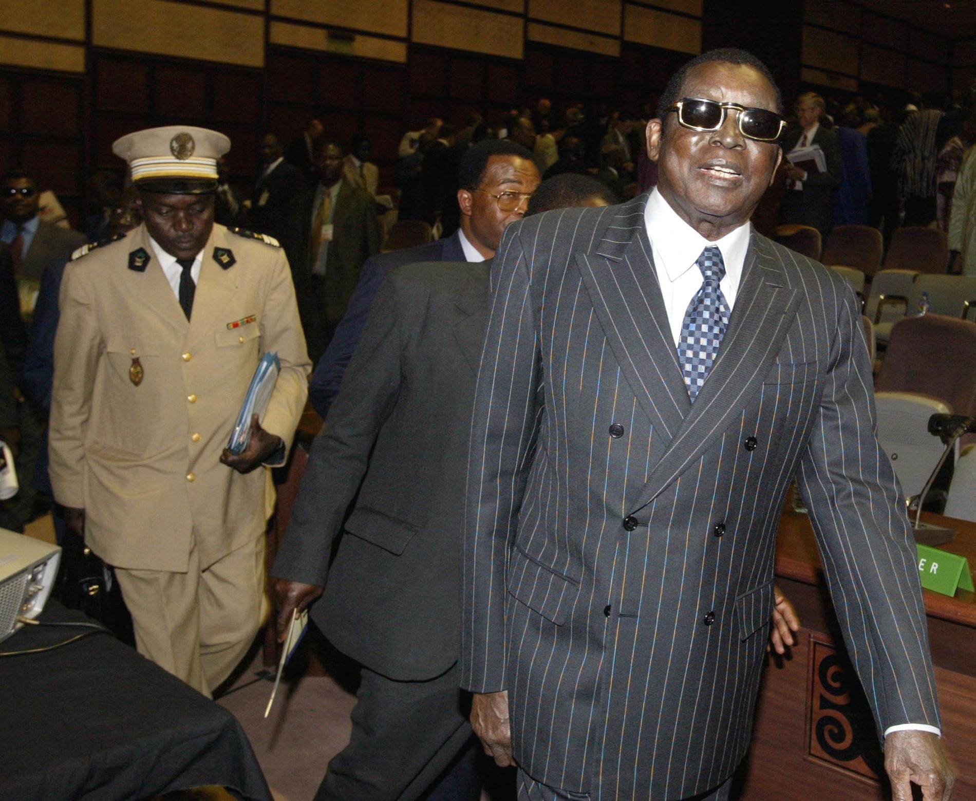 Gnassingbe Eyadema, right, President of Togo arrives for the start of the ECOWAS