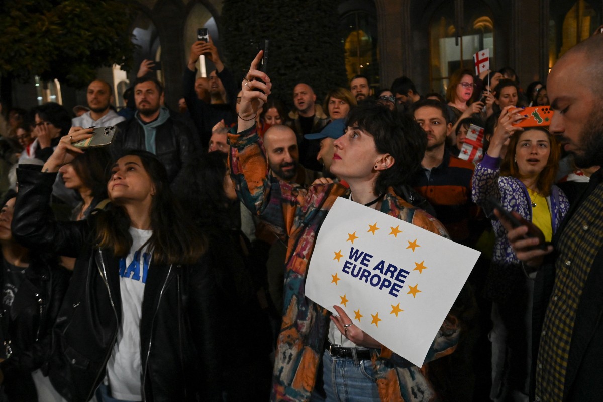 Georgian pro-democracy groups activists protest against a repressive "foreign influence" bill outside the parliament