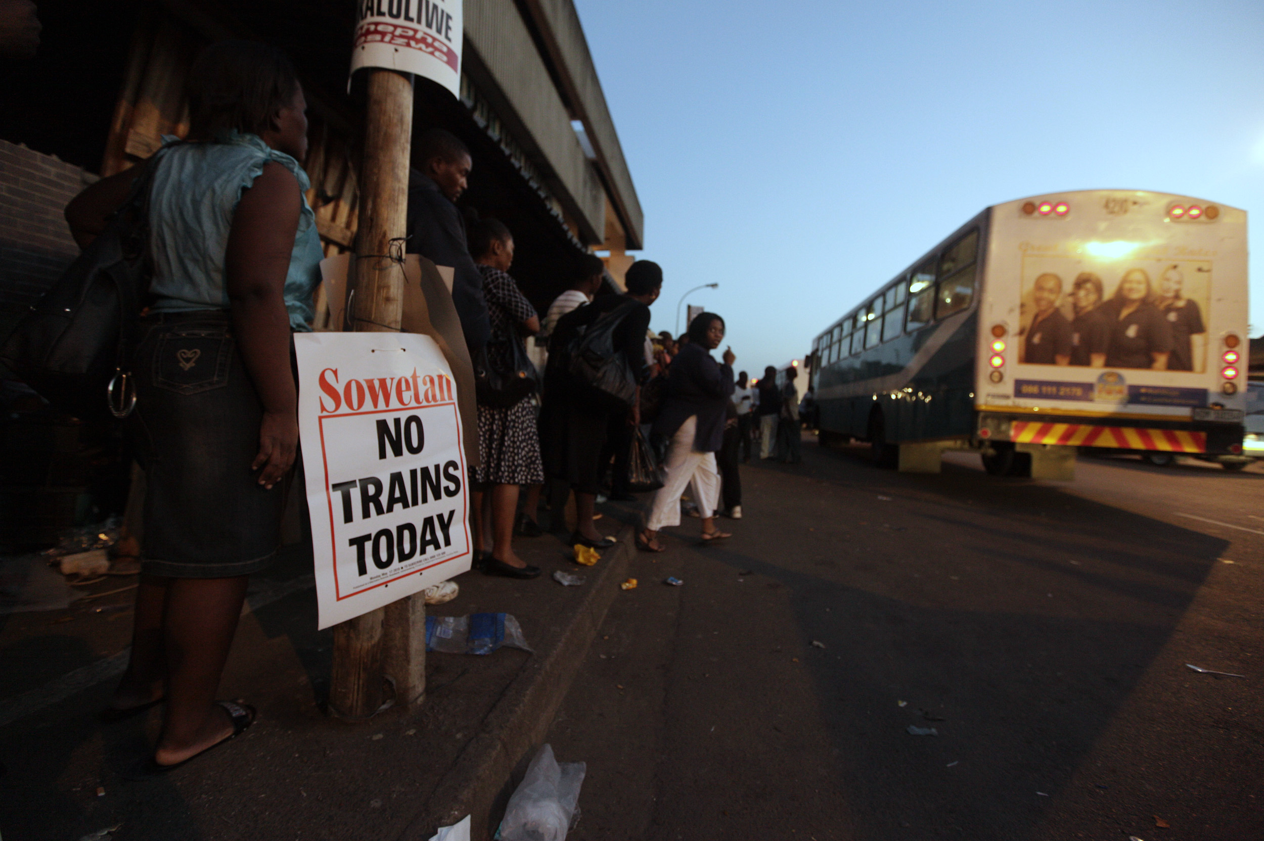 Commuters queue for an alternate transport as rail workers strike in Durban