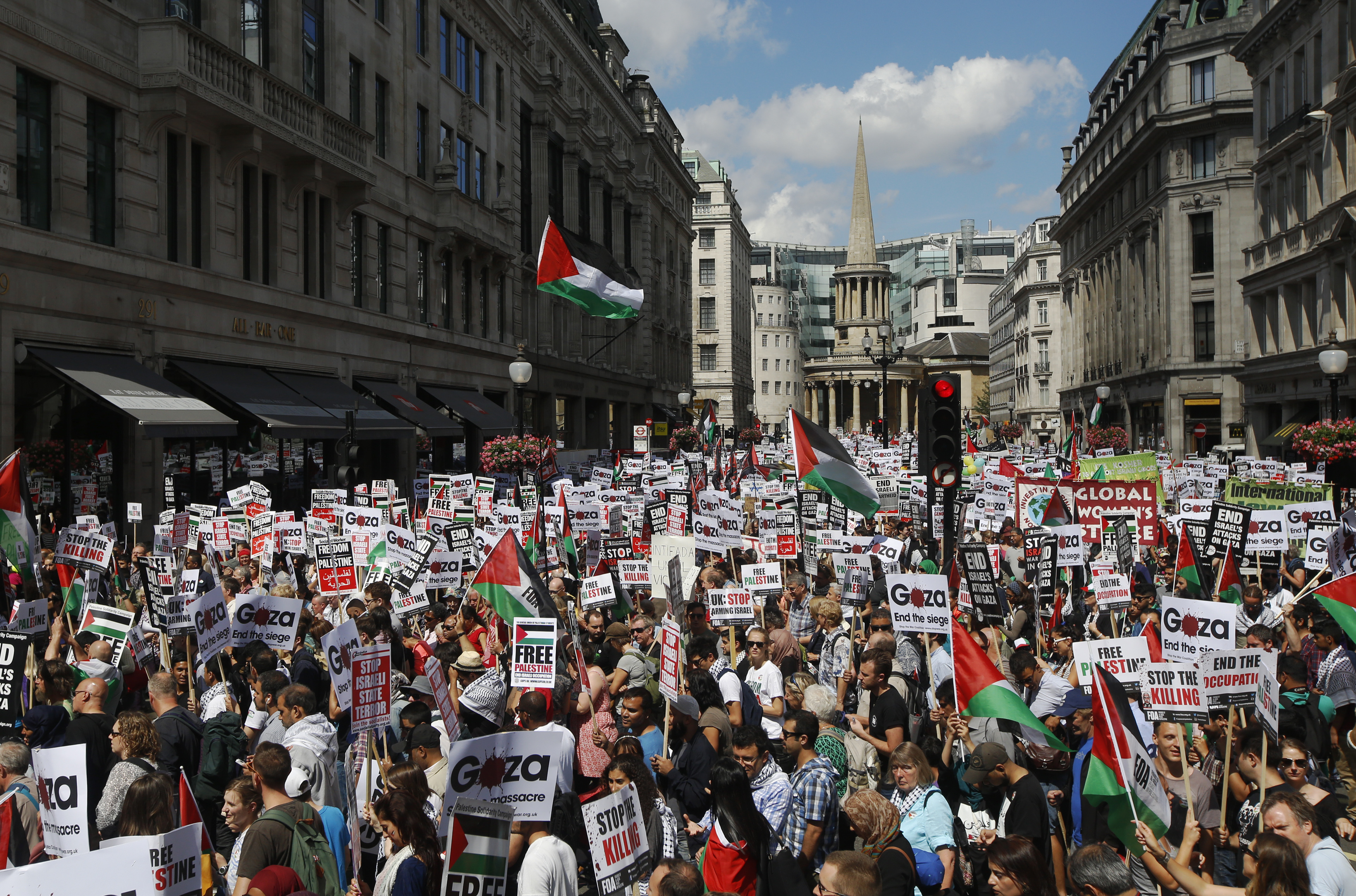 Demonstrators join a rally to support the people of Gaza, in central London August 9, 2014. Israel launched more than 30 aerial attacks in Gaza on Saturday, killing five Palestinians, and militants fired rockets at Israel as the conflict entered a second month, defying international efforts to negotiate an agreement for an extended ceasefire. REUTERS/Luke MacGregor (BRITAIN - Tags: POLITICS CONFLICT)