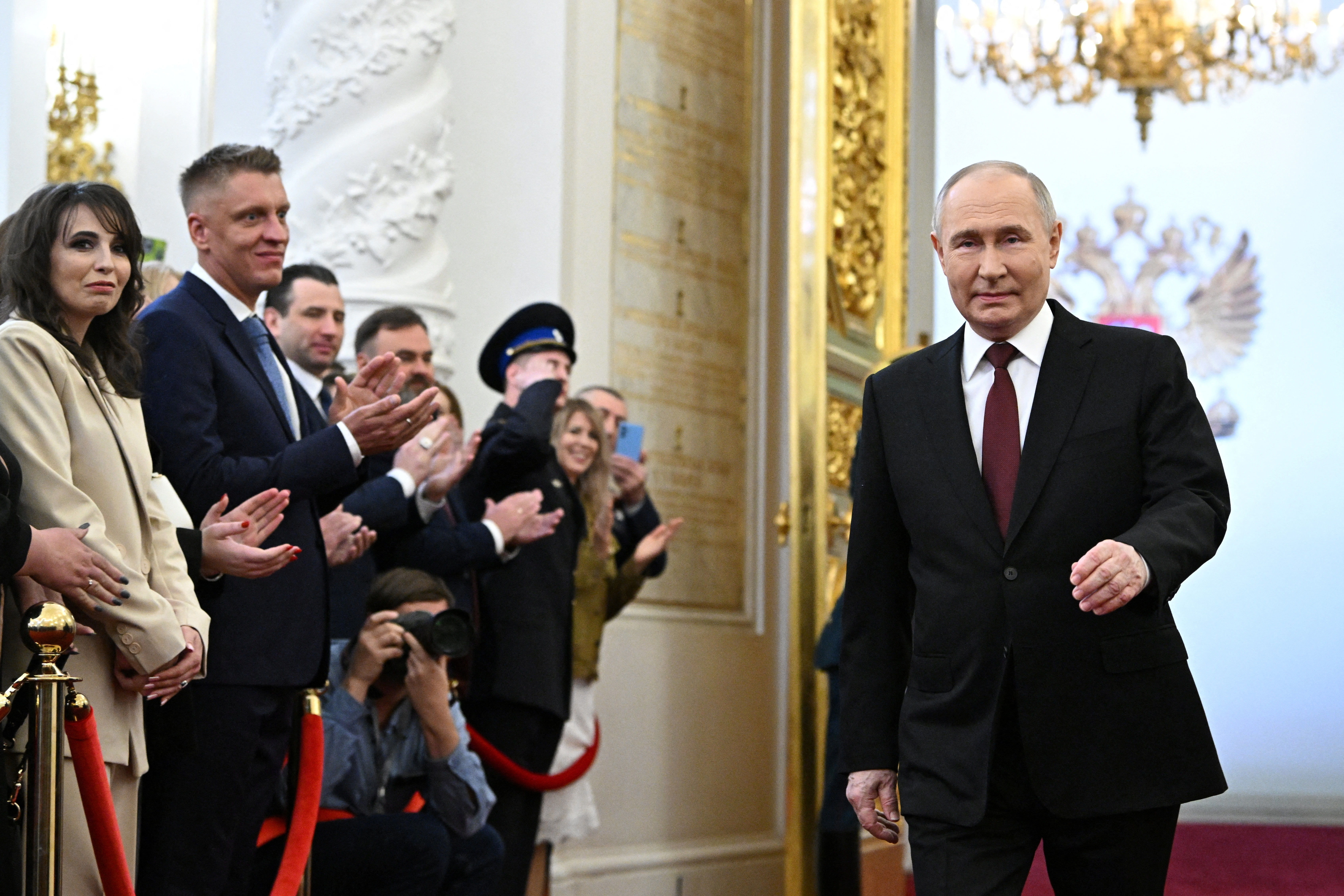 A honour guard carries the Constitution of the Russian Federation and the President's sign