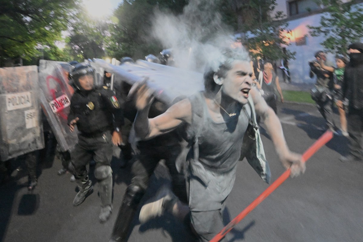 Demonstrators clash with the police during a pro-Palestinian rally called "Urgent action for Rafah"