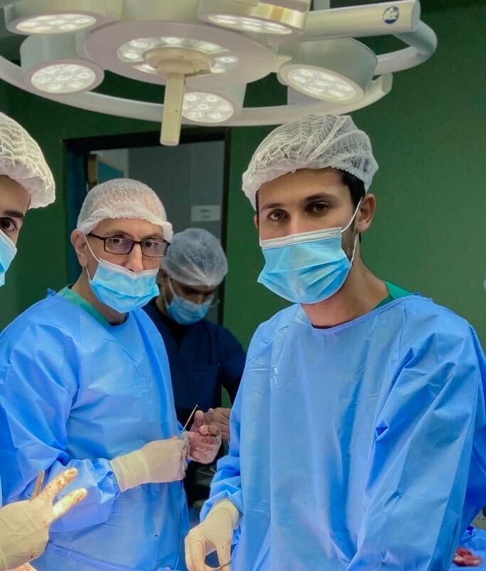 Mohammed Harara, far right, with his colleagues in the operating room 