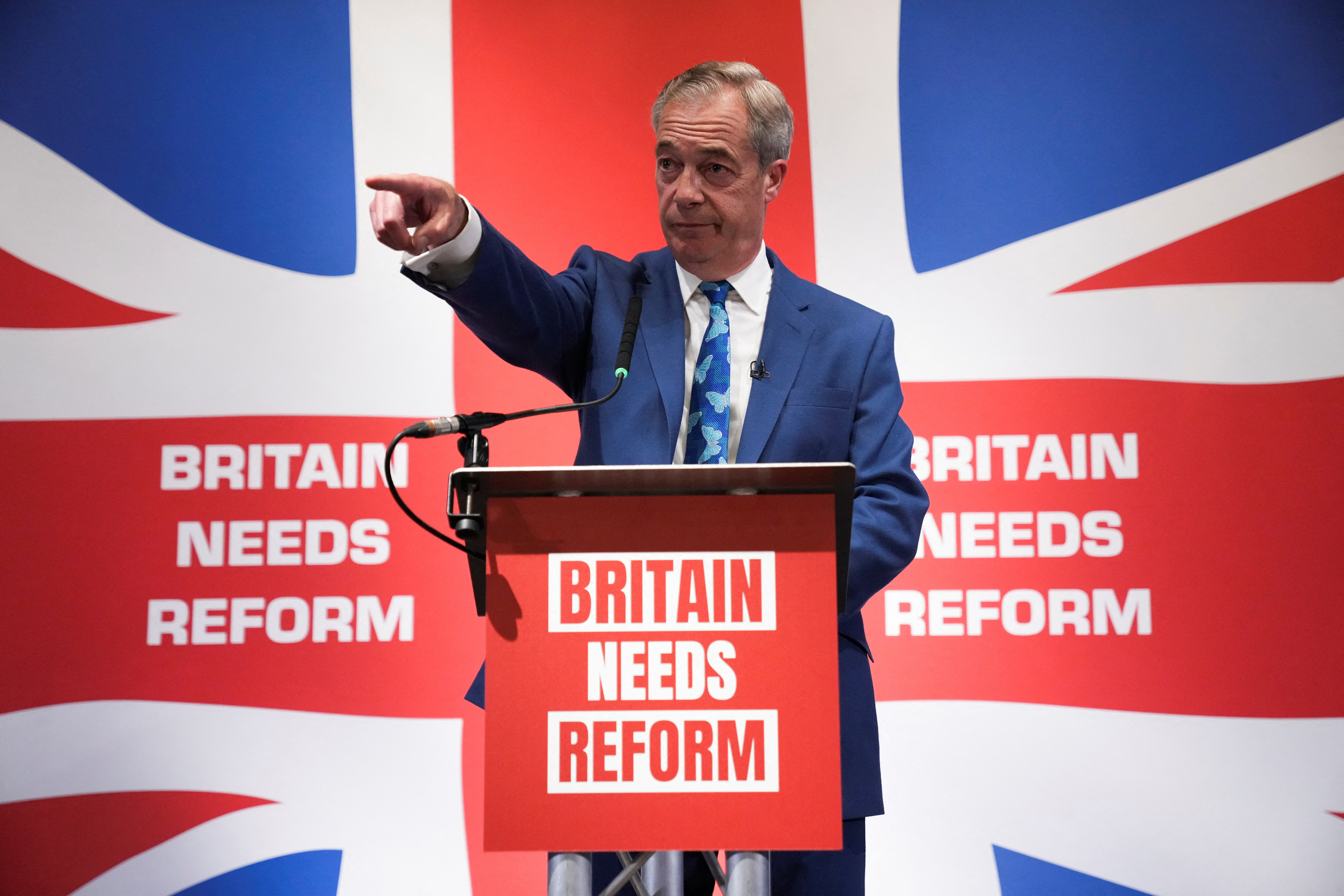 Honorary President of the Reform UK party Nigel Farage gestures during a press conference in London, Britain [File: Maja Smiejkowska/Reuters]