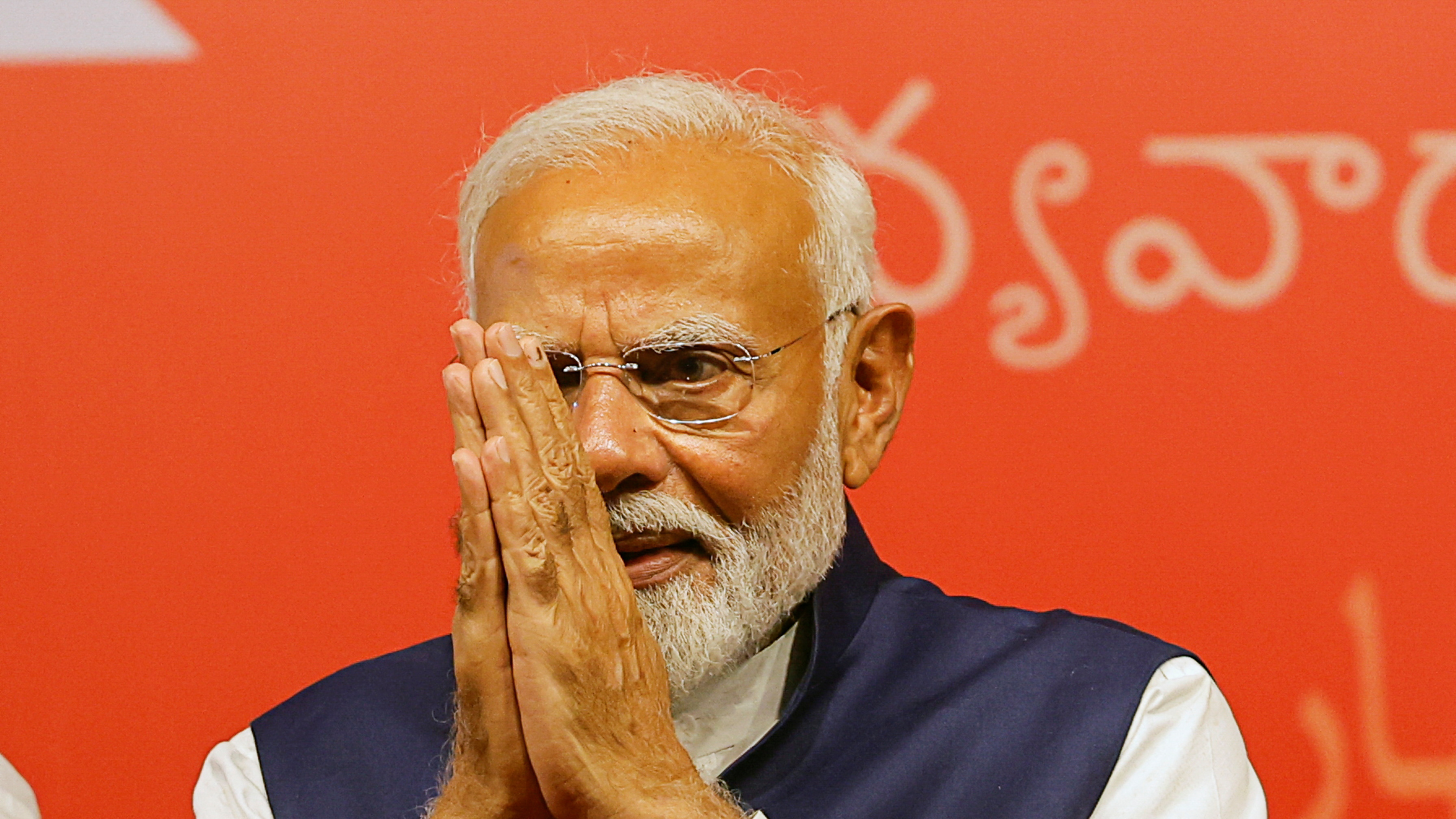 Indian Prime Minister Narendra Modi gestures, at the Bharatiya Janata Party (BJP) headquarters in New Delhi