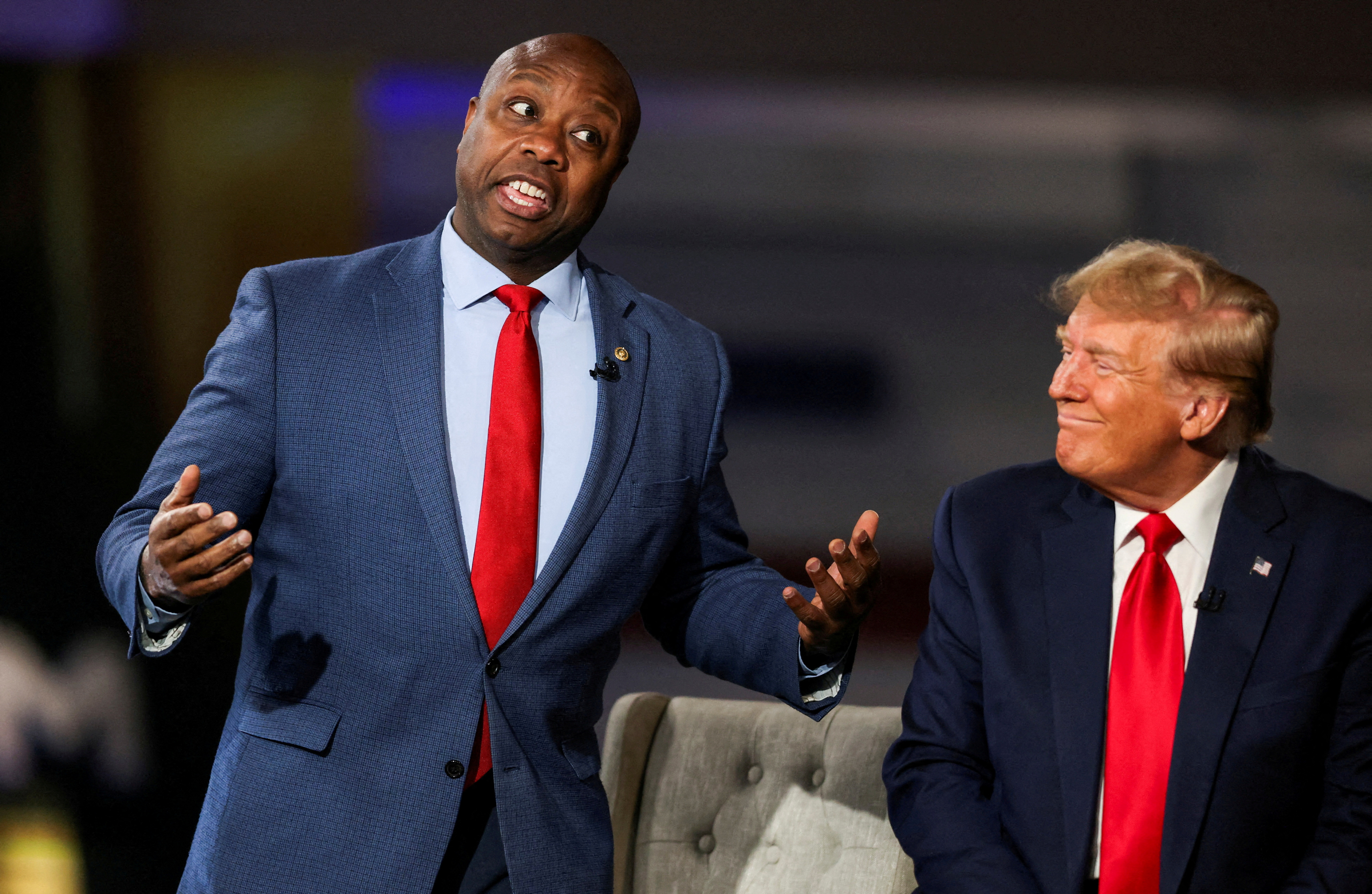 Scott (left) speaks during a Fox News town hall in February alongside Trump