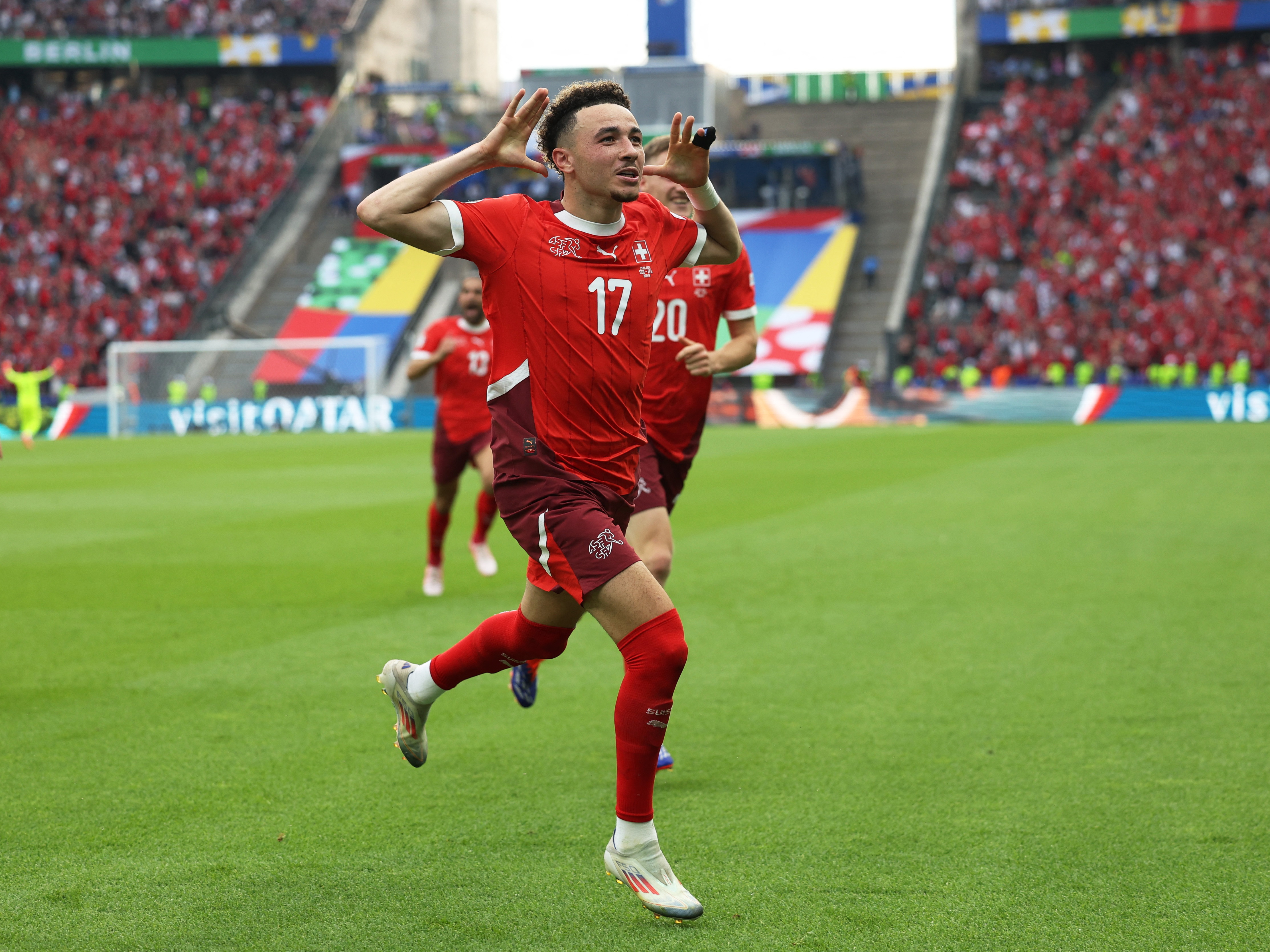 Footballer cleebrates goal.