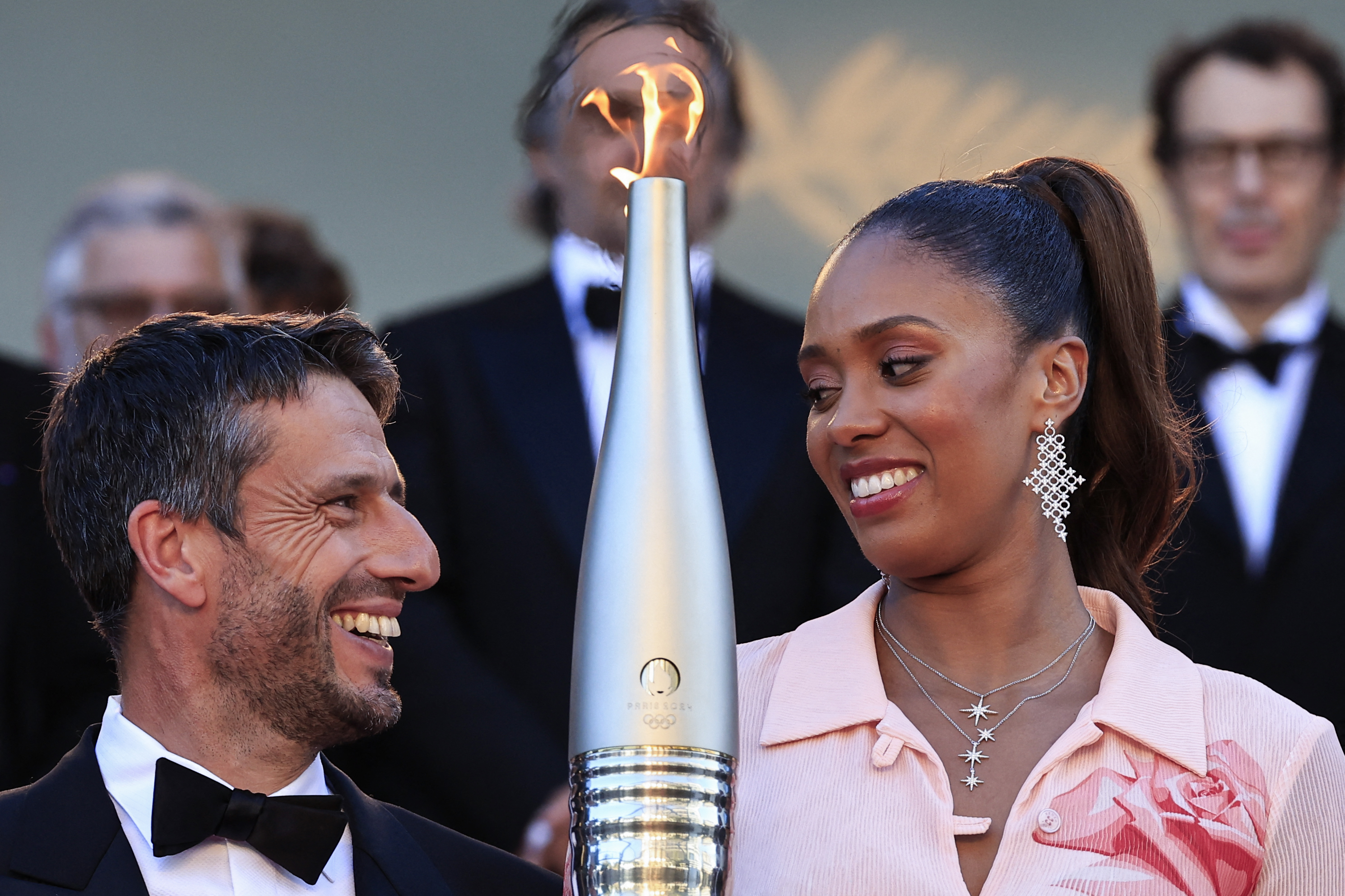 Athlete holds Olympic torch