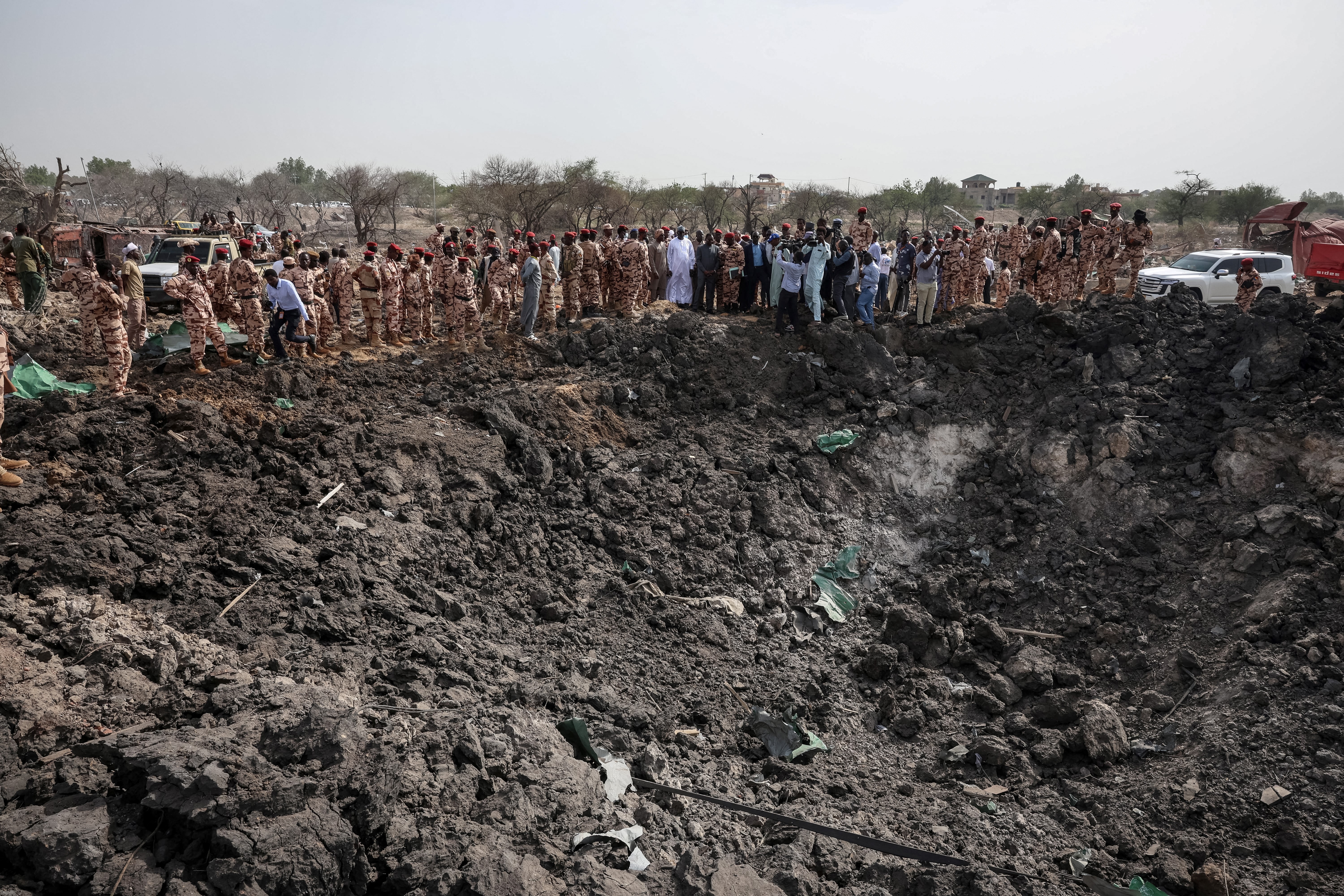 Members of the Chadian security forces stand at the scene of the fire at a ammunition depot