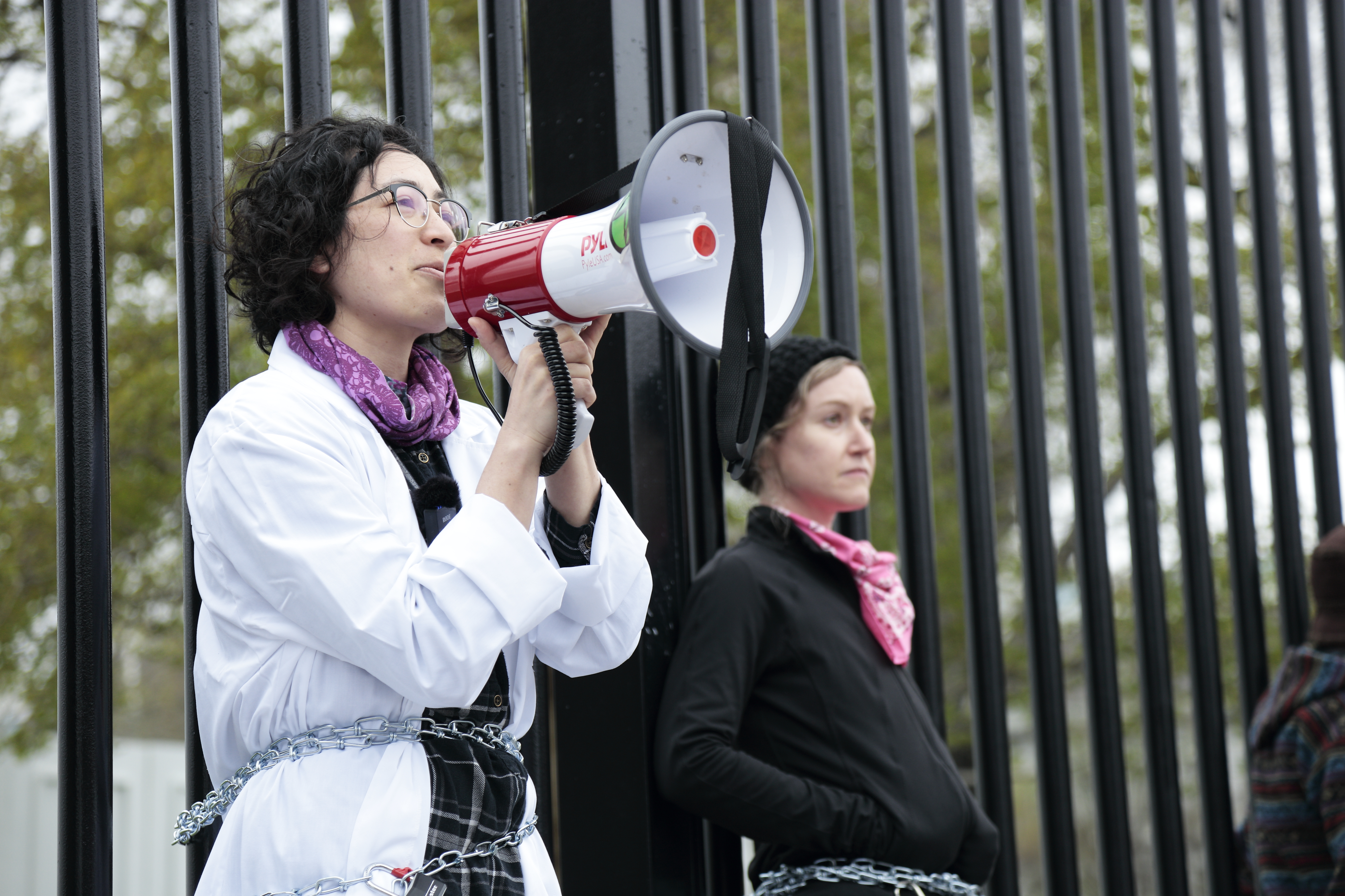 Abramoff speaks after she and another activist chained themselves to the fence surrounding the White House - a federal offense (2022)