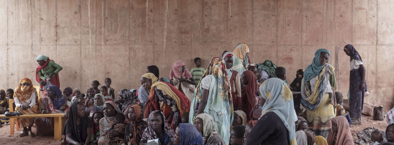 Sudanese refugee women wait to register with the UN Refugee Agency after escaping fighting and famine in Darfur.