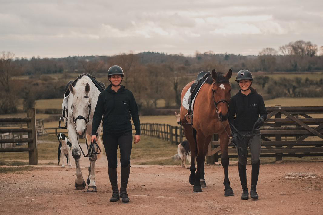 Nour Slaoui and Cash in Hand, left, during a training session with her coach and business partner Deborah Fellous in Oakley, England [Courtesy of Nour Slaoui]