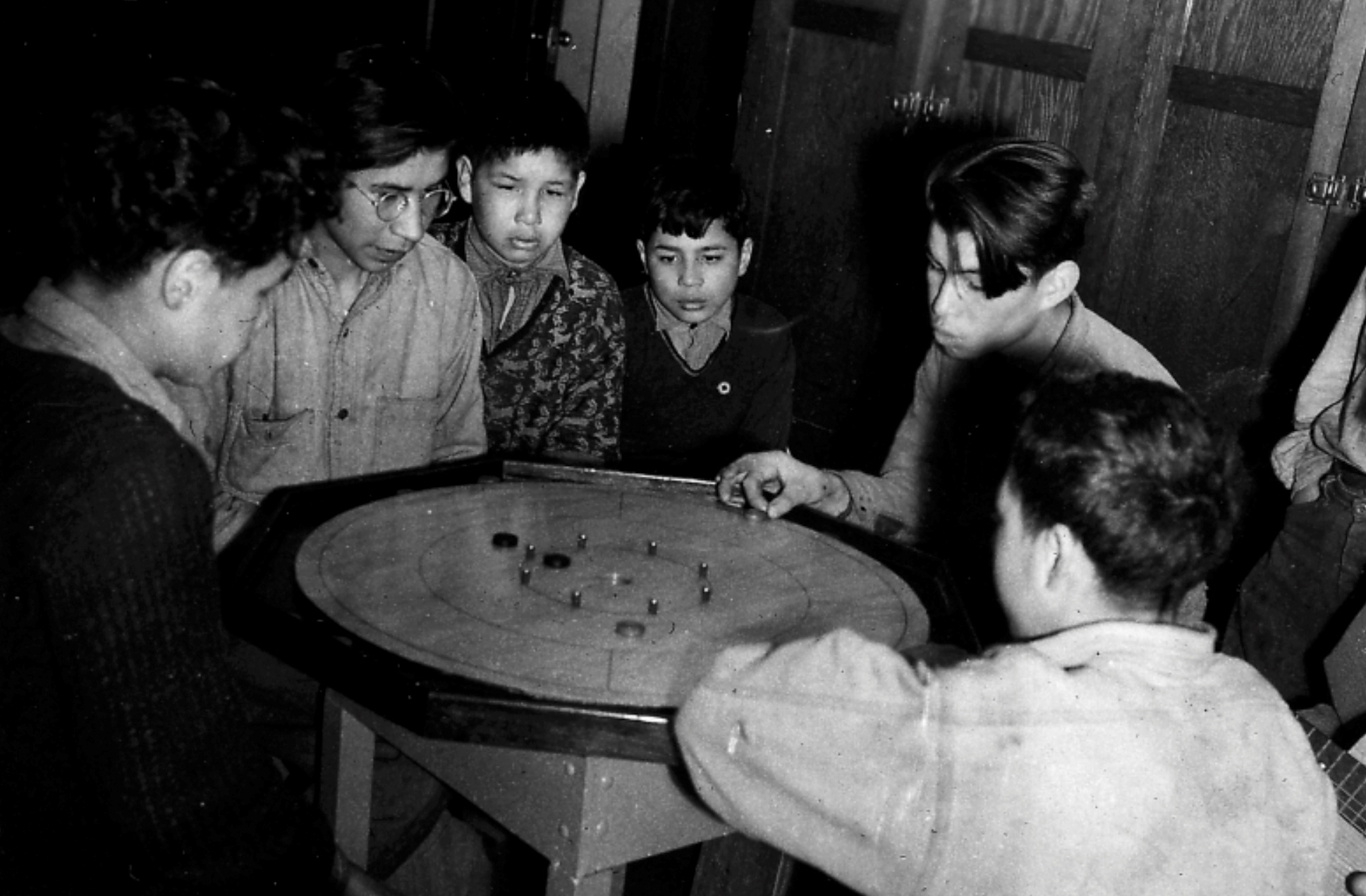 Boys play a board game at the Shingwauk Indian Residential School in Sault Ste Marie, Ontario, Canada in the 1940s