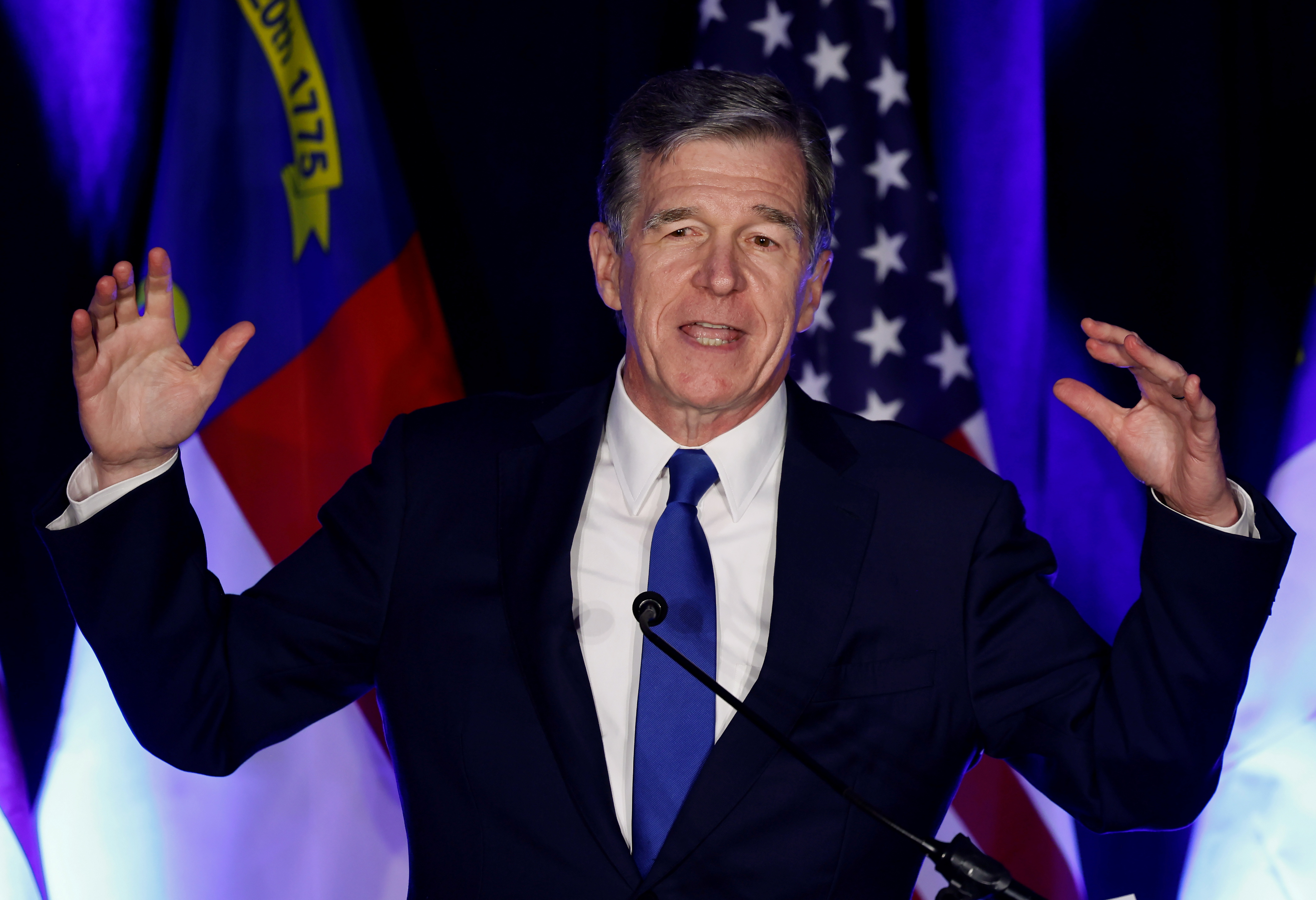 Roy Cooper speaks at a Democratic Party watch party as the primary elections wrap up in Raleigh