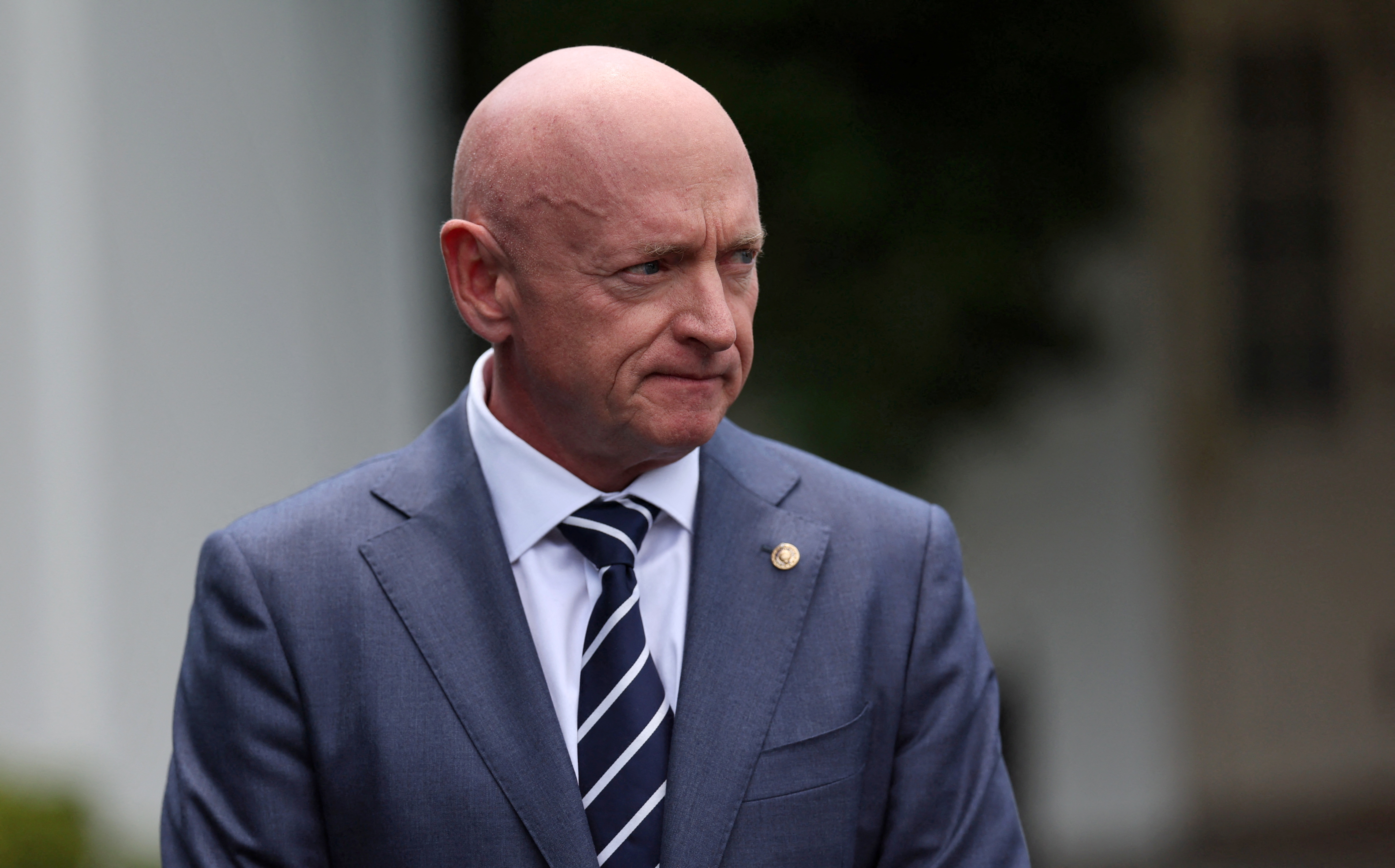 US Senator Mark Kelly speaks to members of the news media ahead