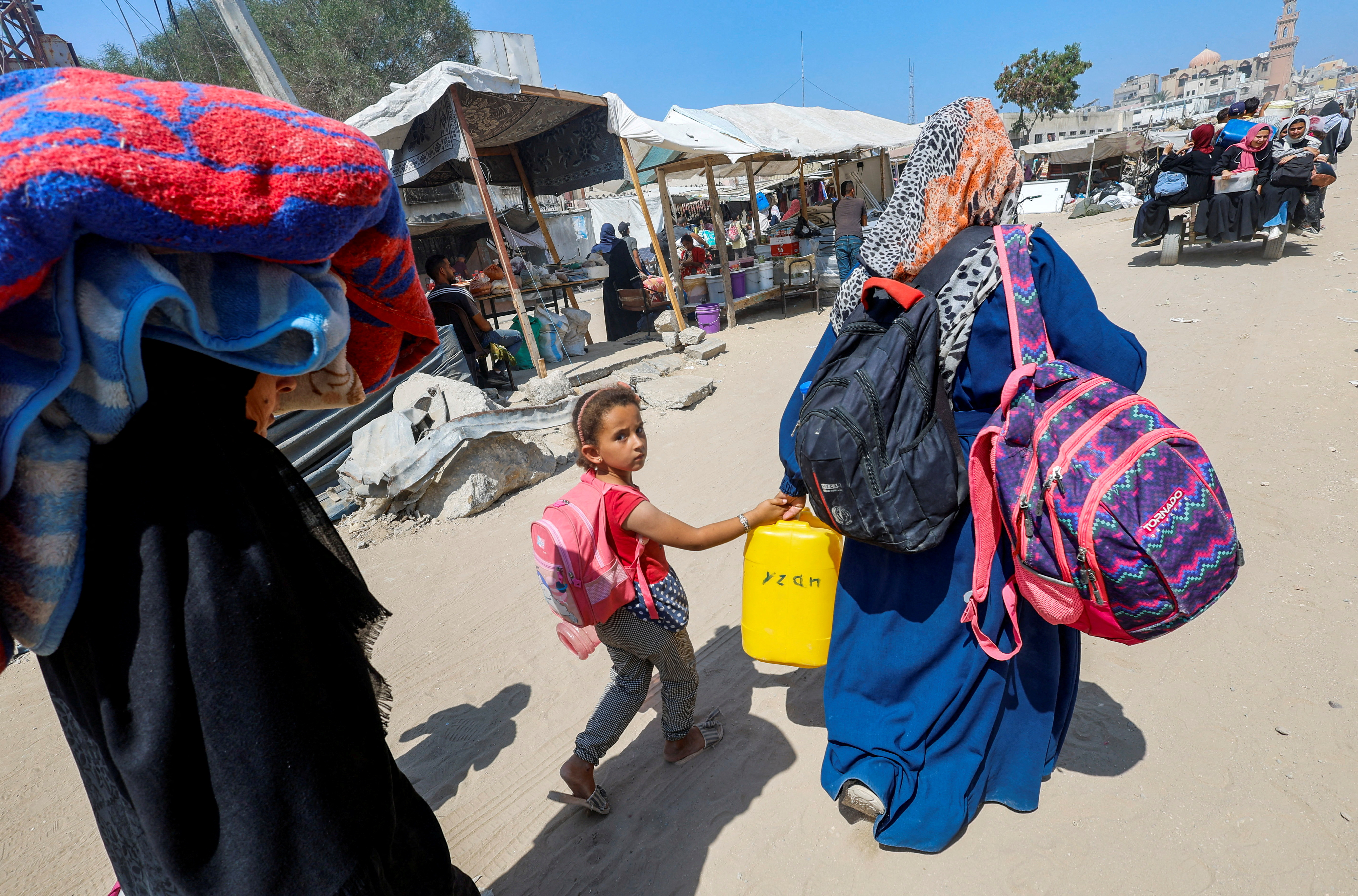 Palestinians, who fled the eastern part of Khan Younis