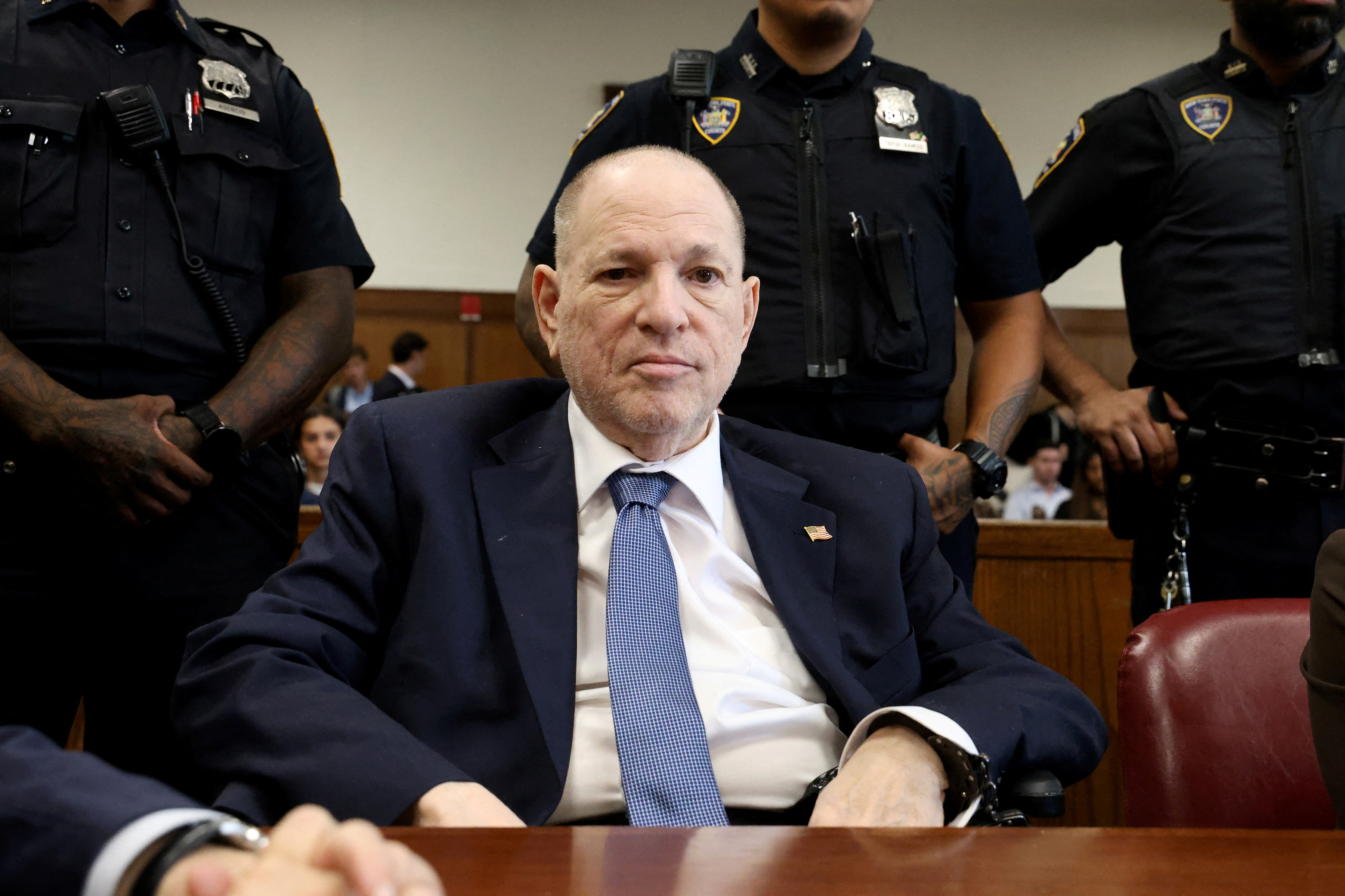 Disgraced Hollywood producer Harvey Weinstein sits in court