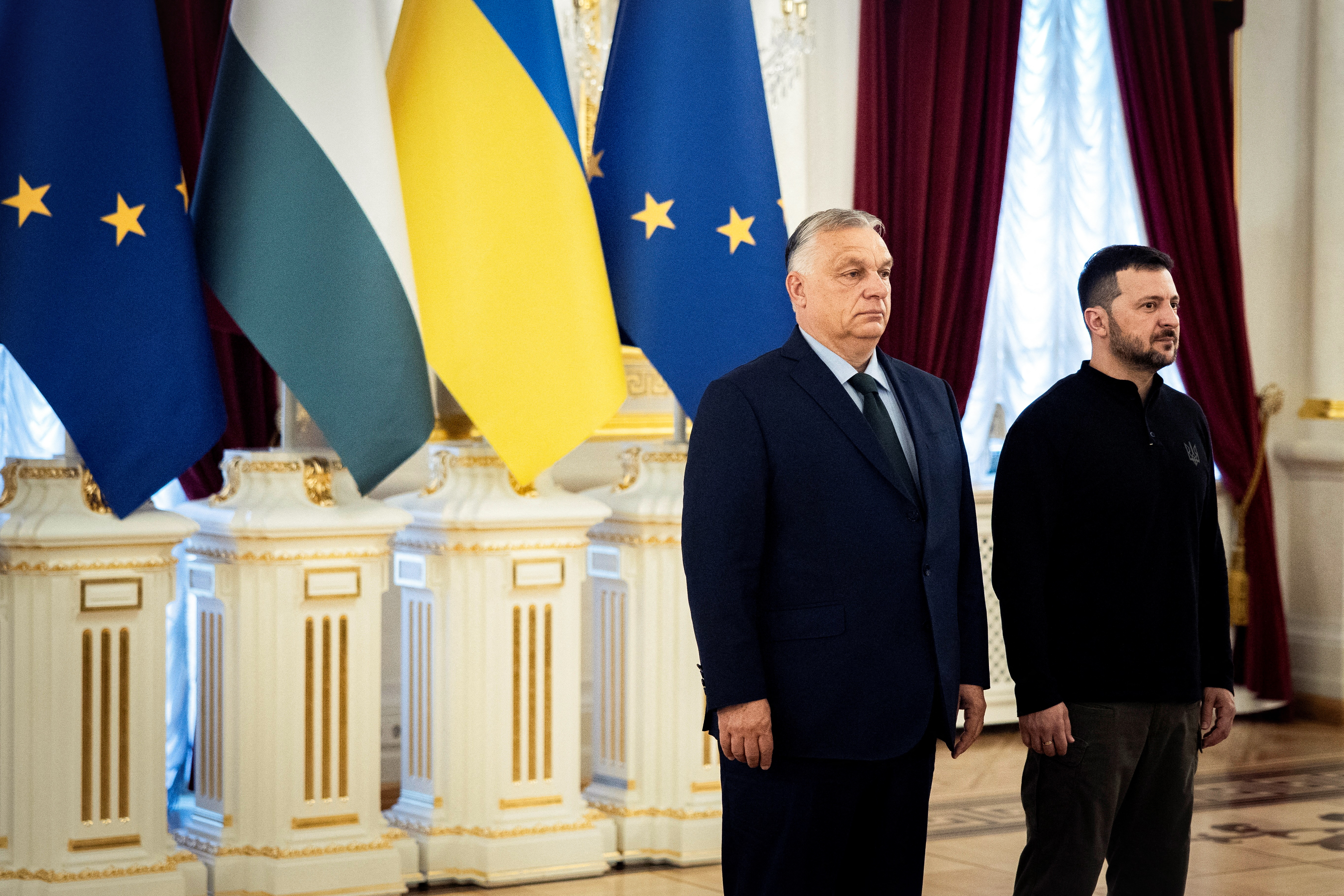 In this handout photograph taken and released on July 2, 2024, by the Hungarian Prime Minister's Press office, Ukraine's President Volodymyr Zelensky (R) poses with Hungary's Prime Minister Viktor Orban ahead of their meeting at the Presidential palace in Kyiv, amid the Russian invasion of Ukraine. (Photo by ZOLTAN FISCHER / Hungarian Prime Minister's press office / AFP) / RESTRICTED TO EDITORIAL USE - MANDATORY CREDIT "AFP PHOTO /AFP PHOTO /ZOLTAN FISCHER/HUNGARIAN PRIME MINISTER'S PRESS OFFICE" - NO MARKETING NO ADVERTISING CAMPAIGNS - DISTRIBUTED AS A SERVICE TO CLIENTS