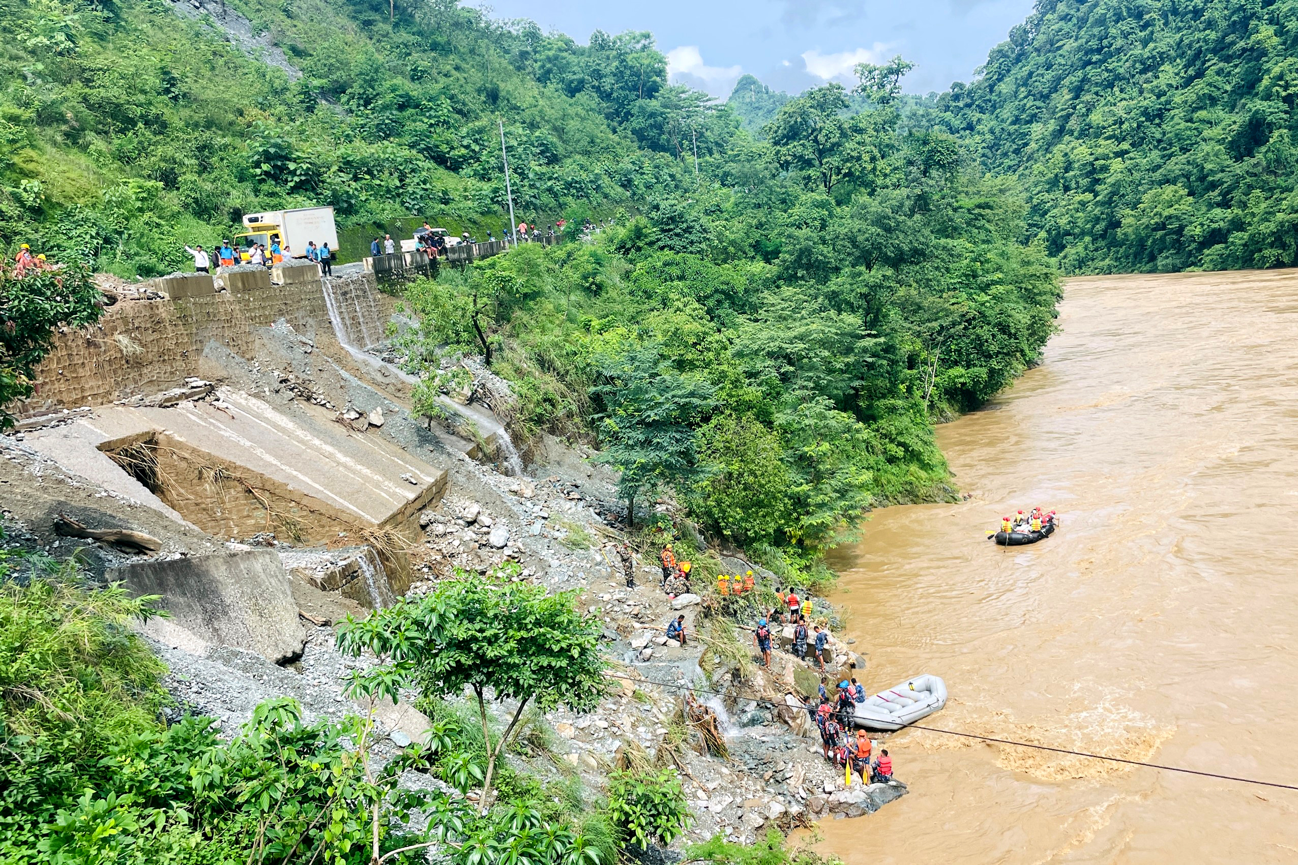 Rescuers search for survivors in the Trishuli river