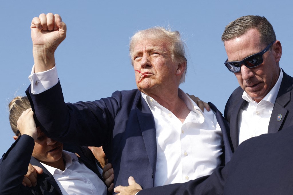 BUTLER, PENNSYLVANIA - JULY 13: Republican presidential candidate former President Donald Trump is rushed offstage during a rally on July 13, 2024 in Butler, Pennsylvania. Butler County district attorney Richard Goldinger said the shooter is dead after injuring former U.S. President Donald Trump, killing one audience member and injuring another in the shooting. Anna Moneymaker/Getty Images/AFP (Photo by Anna Moneymaker / GETTY IMAGES NORTH AMERICA / Getty Images via AFP)