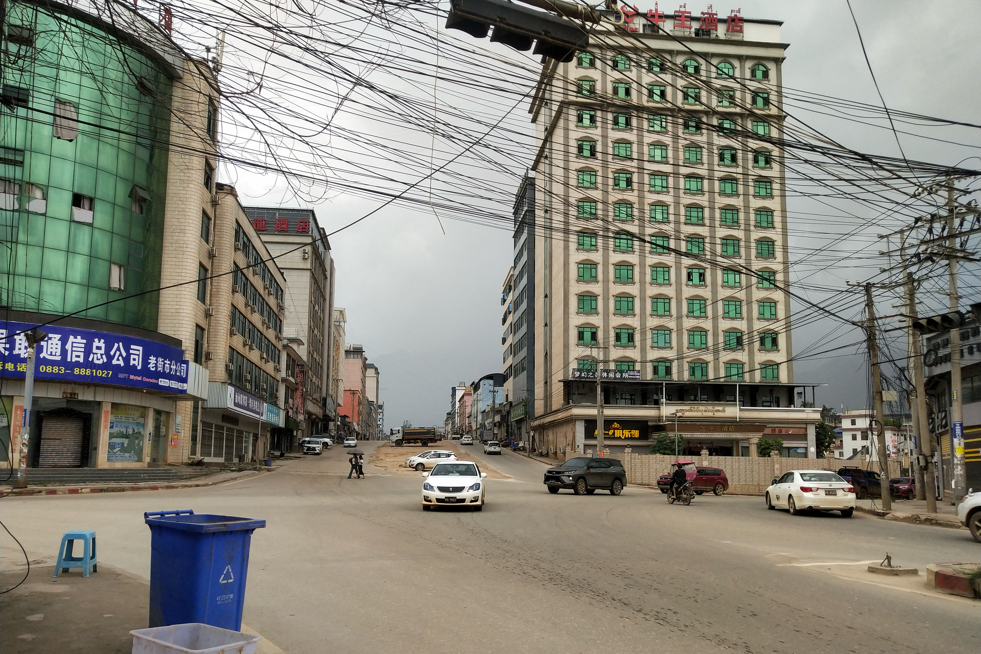 This photo taken on July 14, 2024 shows people commuting on a street in Laukkai in Myanmar's northern Shan State. (Photo by AFP)