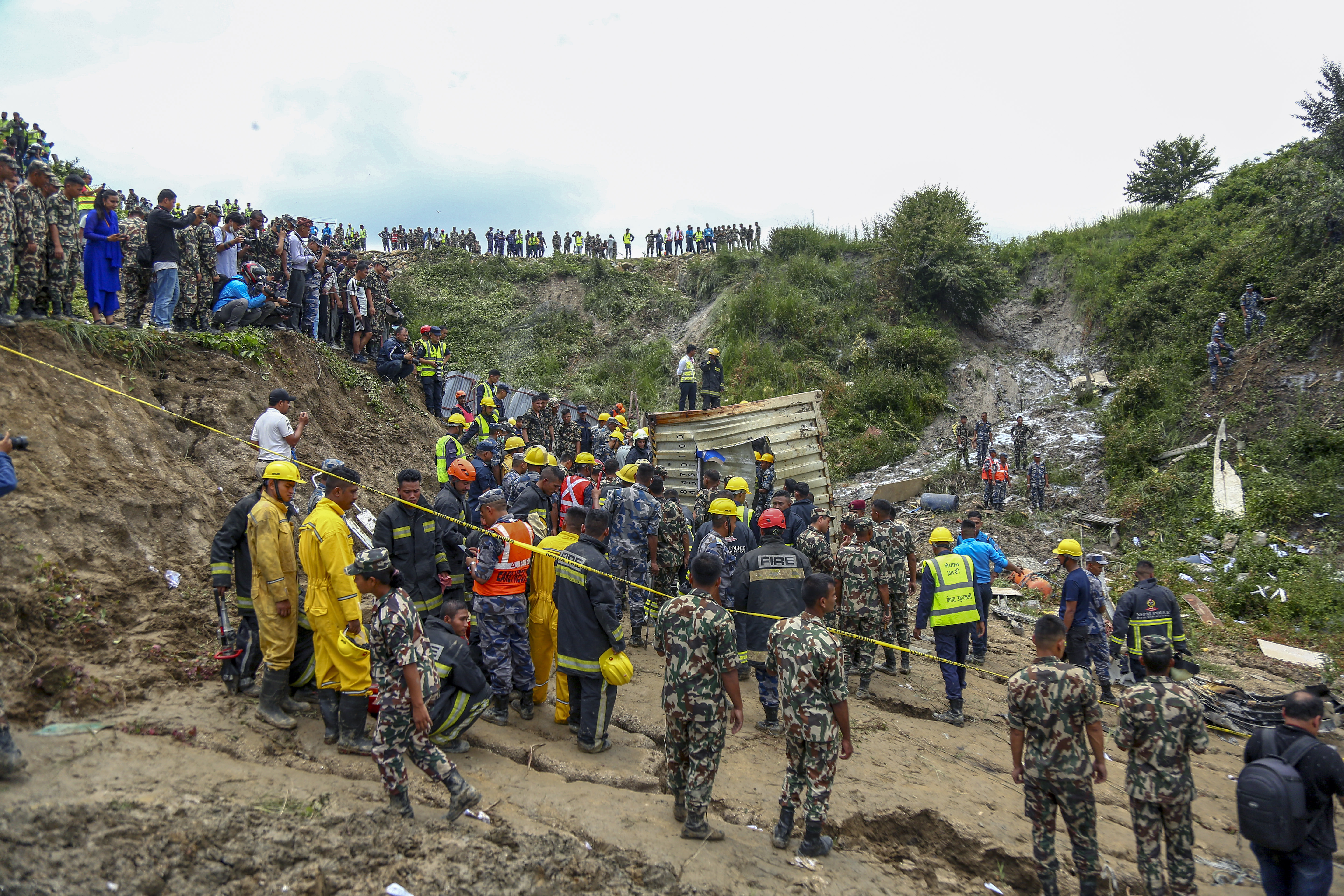 Nepal army personnel cordon off the plane crash site at Tribhuvan International Airport in Kathmandu