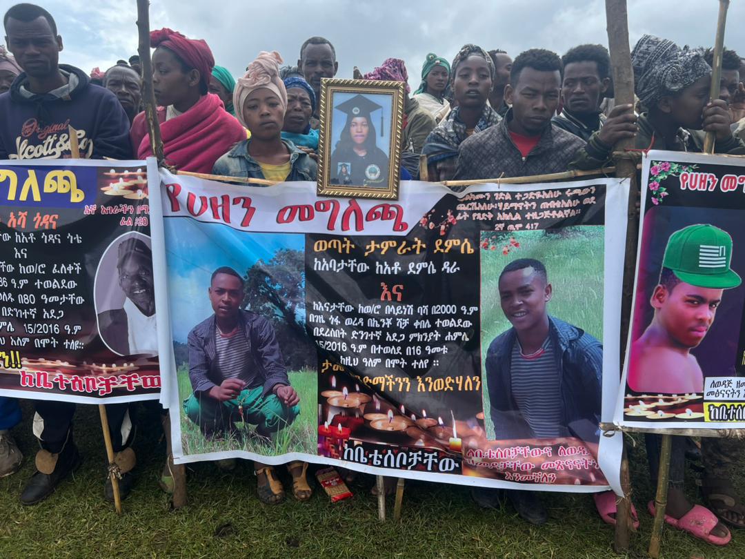 People gathered at a mass funeral for the victims
