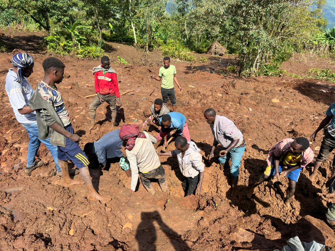 Locals dug through the mud with their bare hands in search of survivors