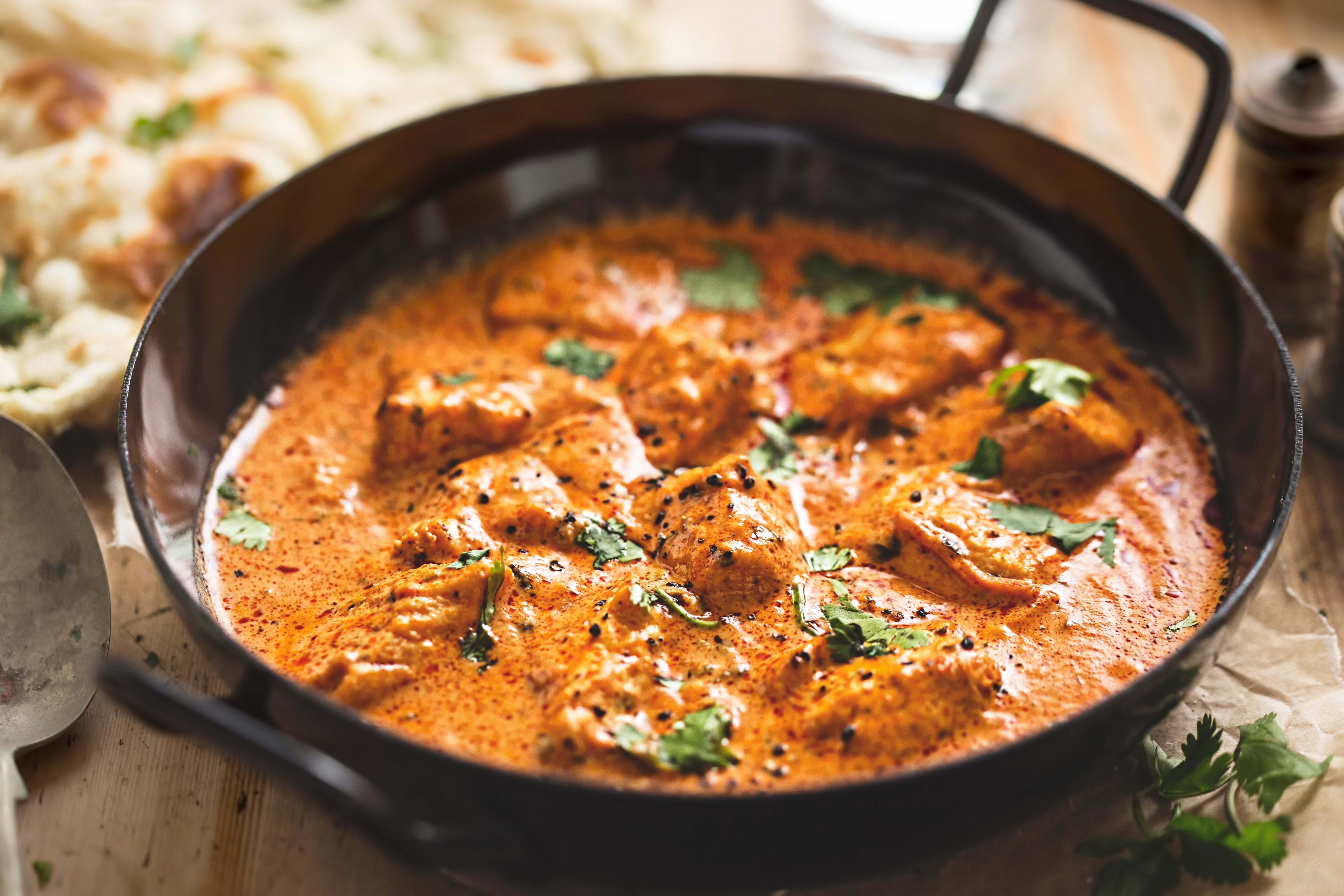 Some say chicken tikka masala was created in a restaurant in Glasgow, Scotland, in the 1950s [Shutterstock]