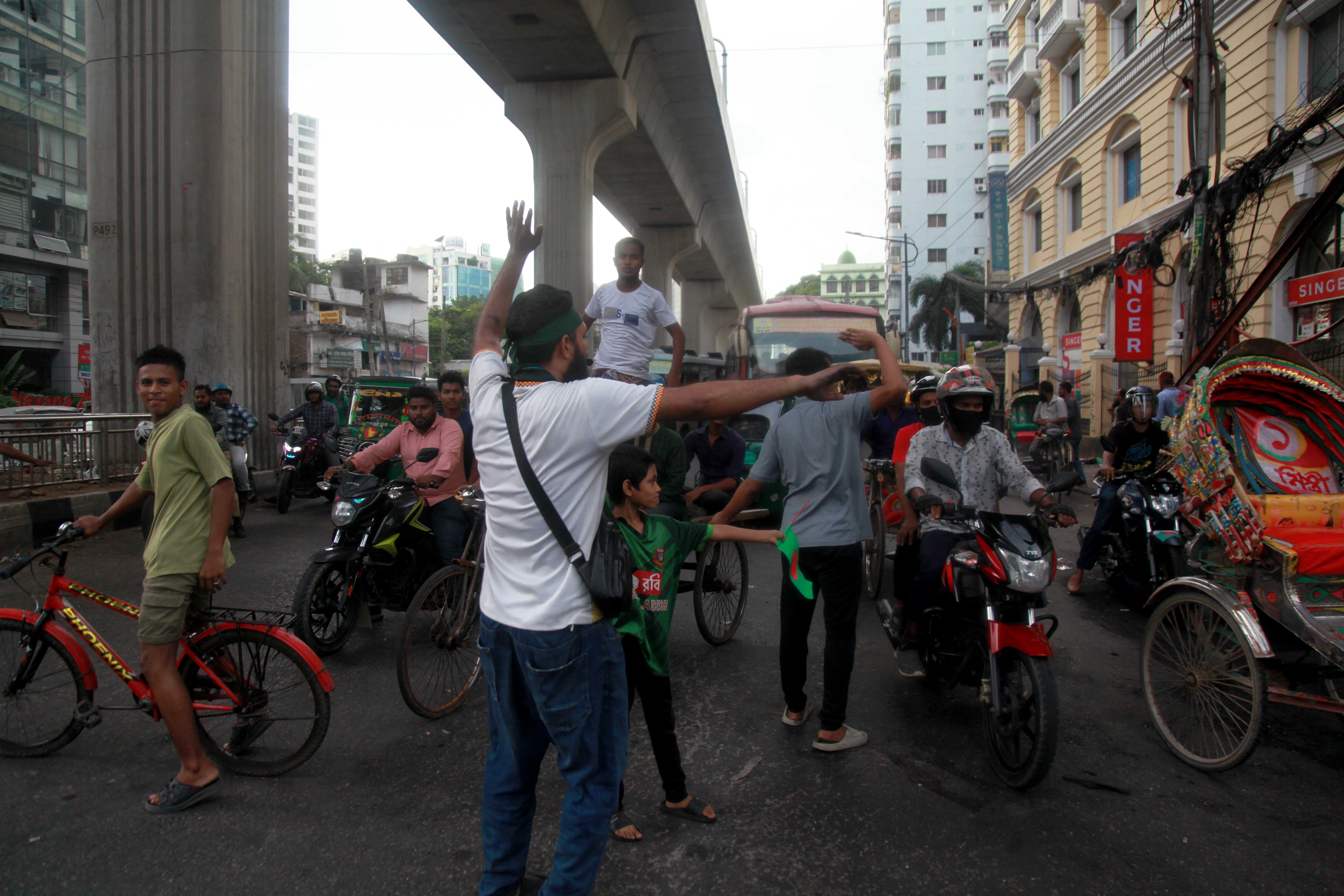 Citizens direct traffic in Dhaka
