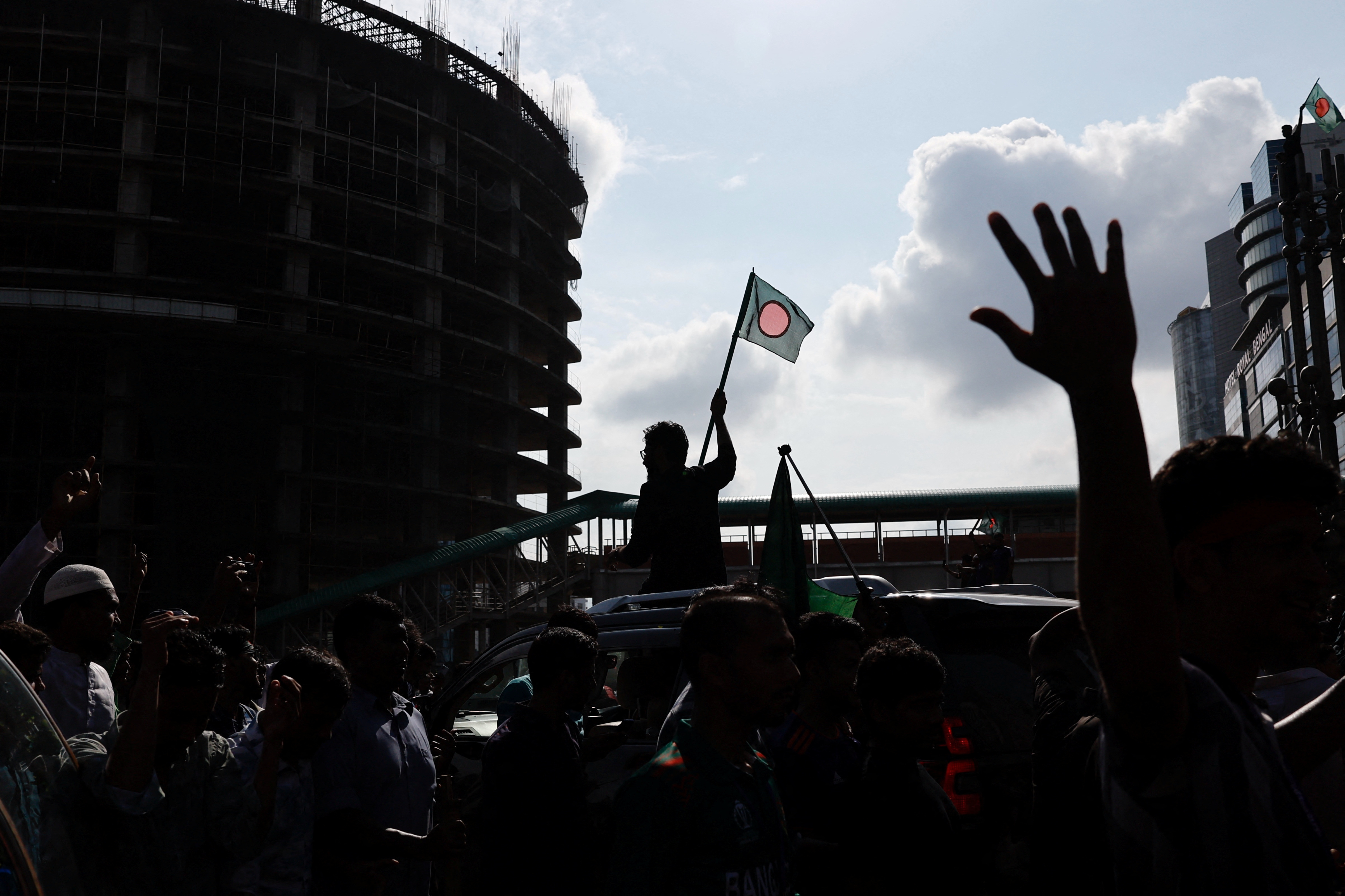 People celebrate the resignation of Bangladeshi Prime Minister Sheikh Hasina in Dhaka