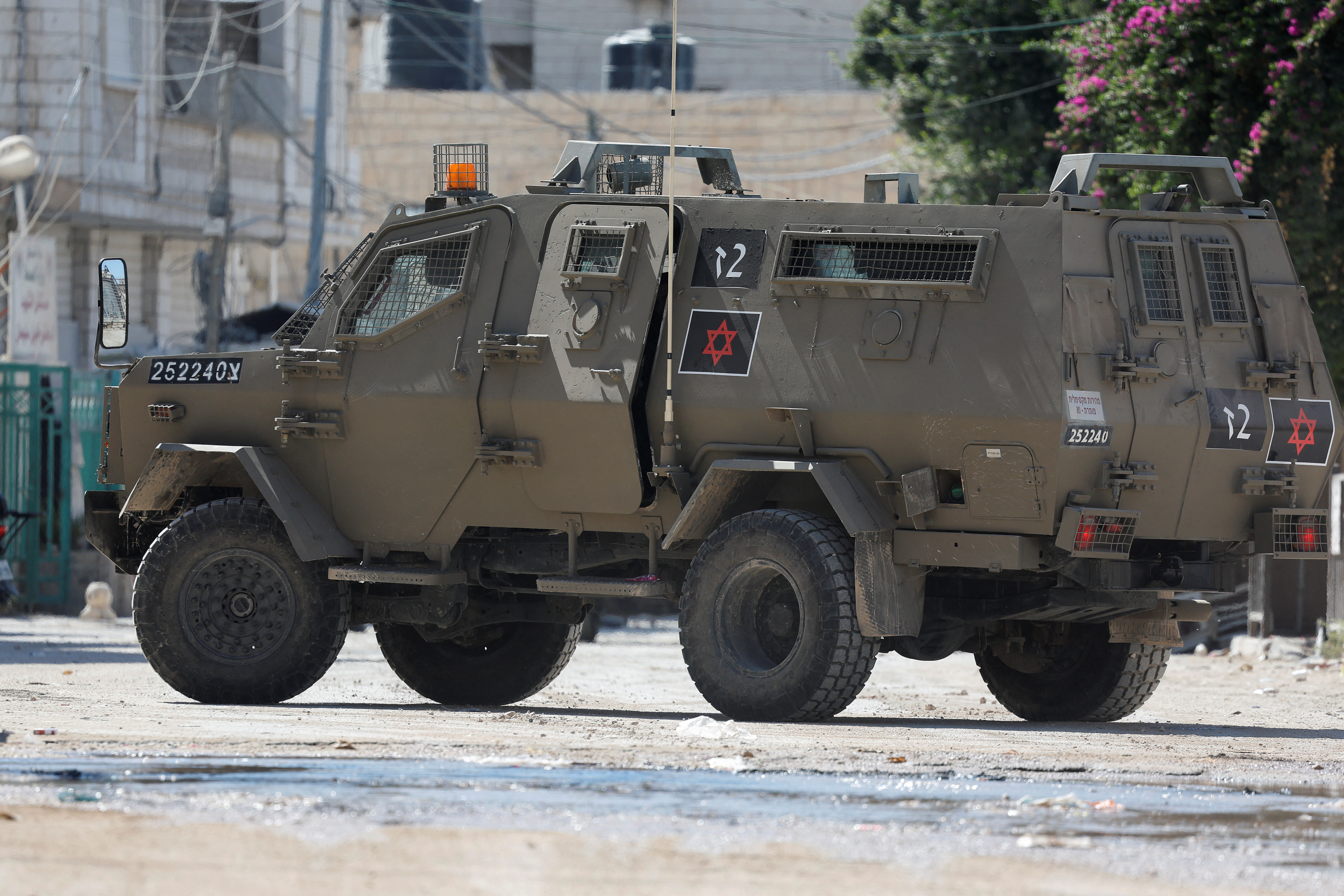 An Israeli military vehicle takes part in an assault on Jenin on August 28, 2024