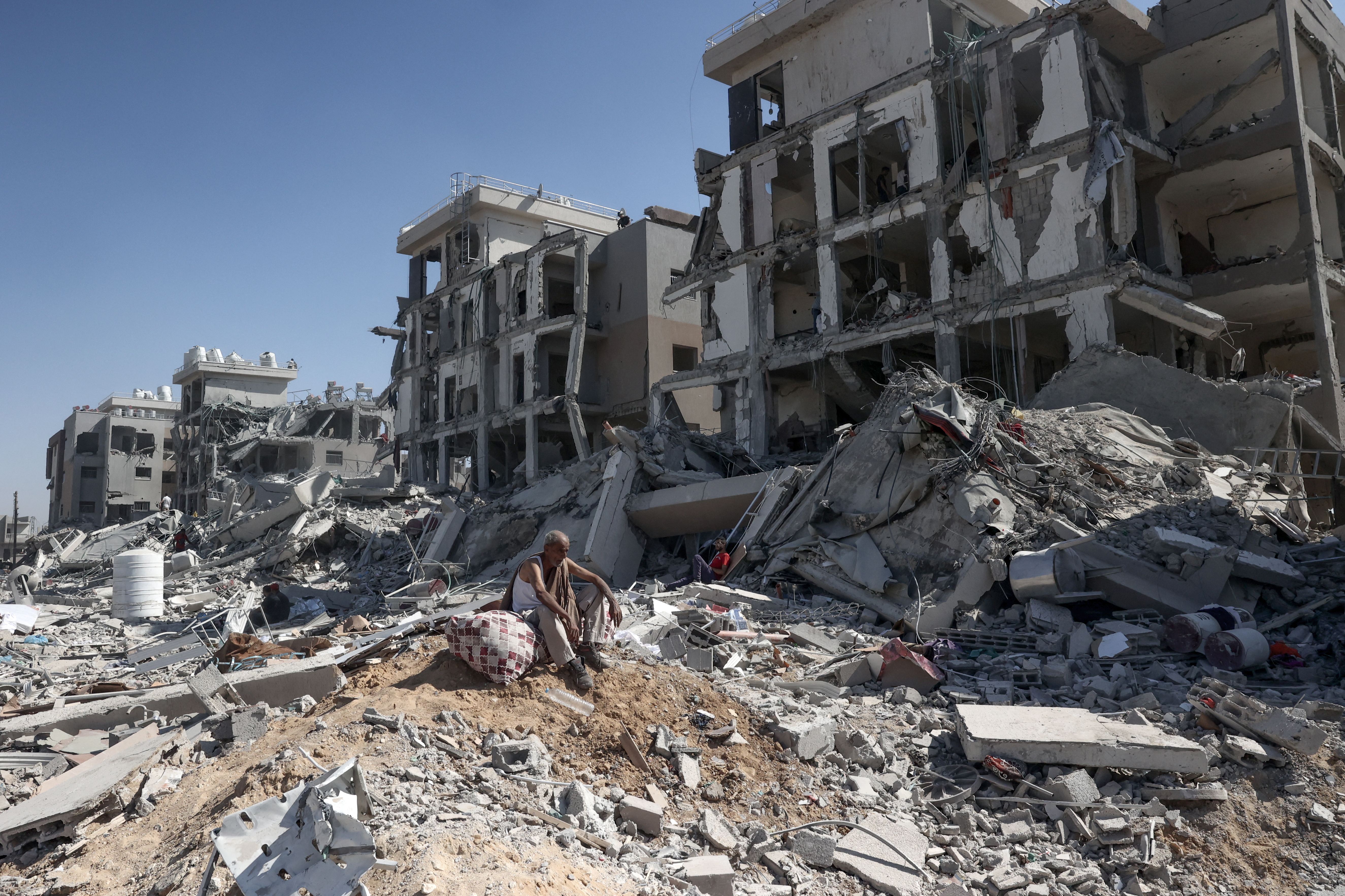 A Palestinian man who retuned briefly to eastern Deir al-Balah in the central Gaza