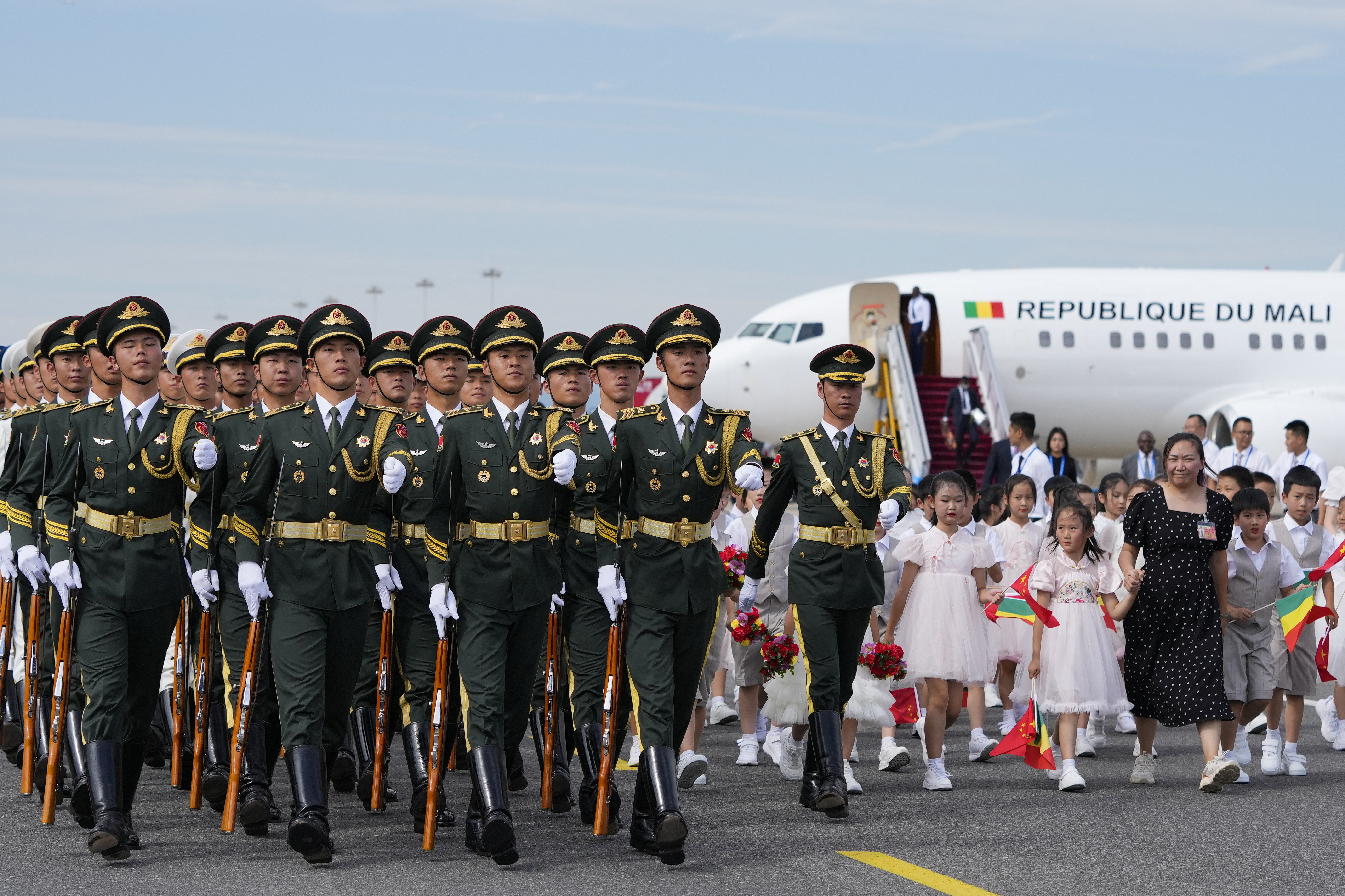 Members of the Chinese honour guard walk past as Interim President of the Republic of Mali, Assimi Goita, arrives at Beijing Capital International Airport ahead of the 2024 Summit of the Forum on China-Africa Cooperation (FOCAC) in Beijing, China, Sep. 1, 2024. Ken Ishii/Pool via REUTERS