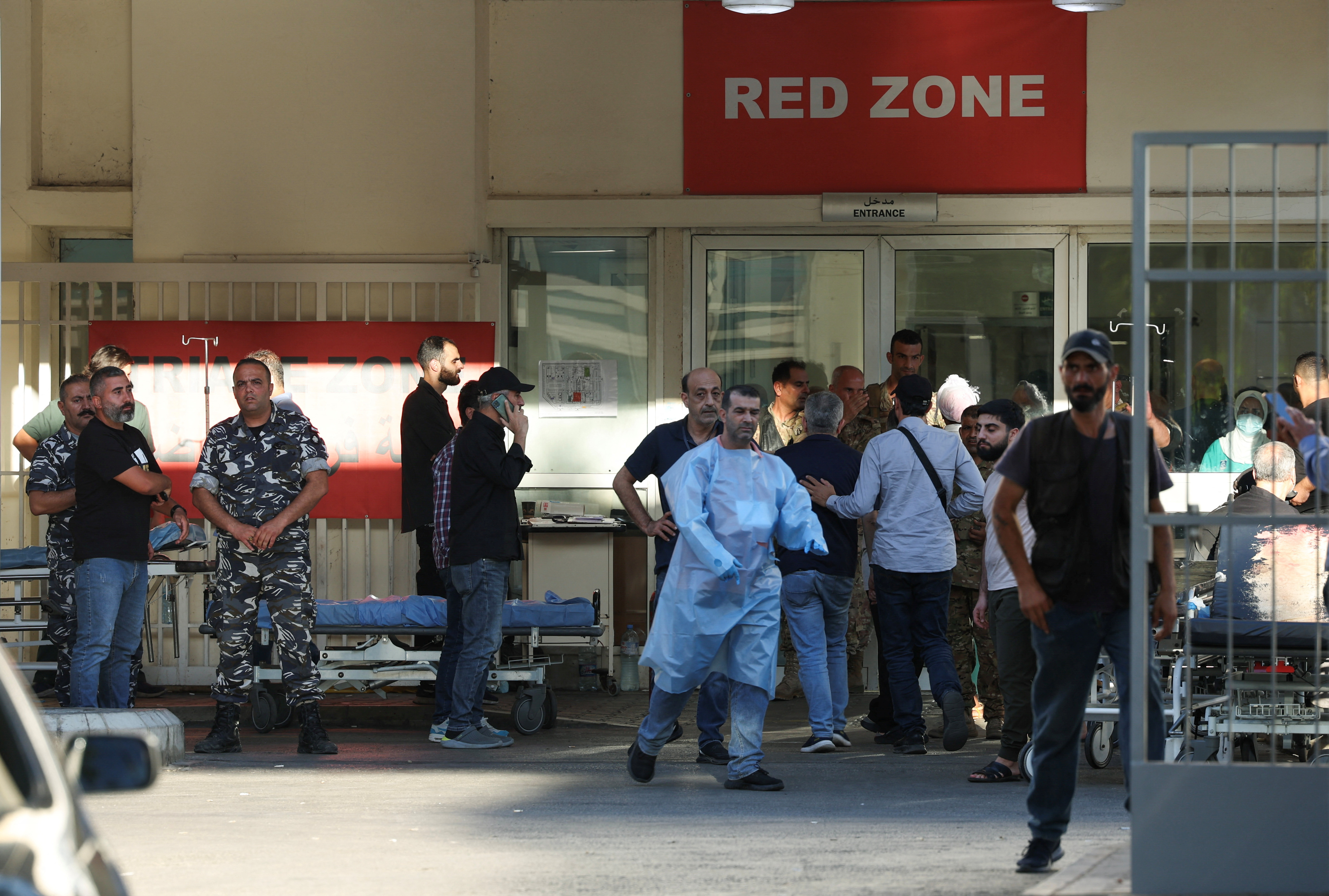 People gather outside a hospital
