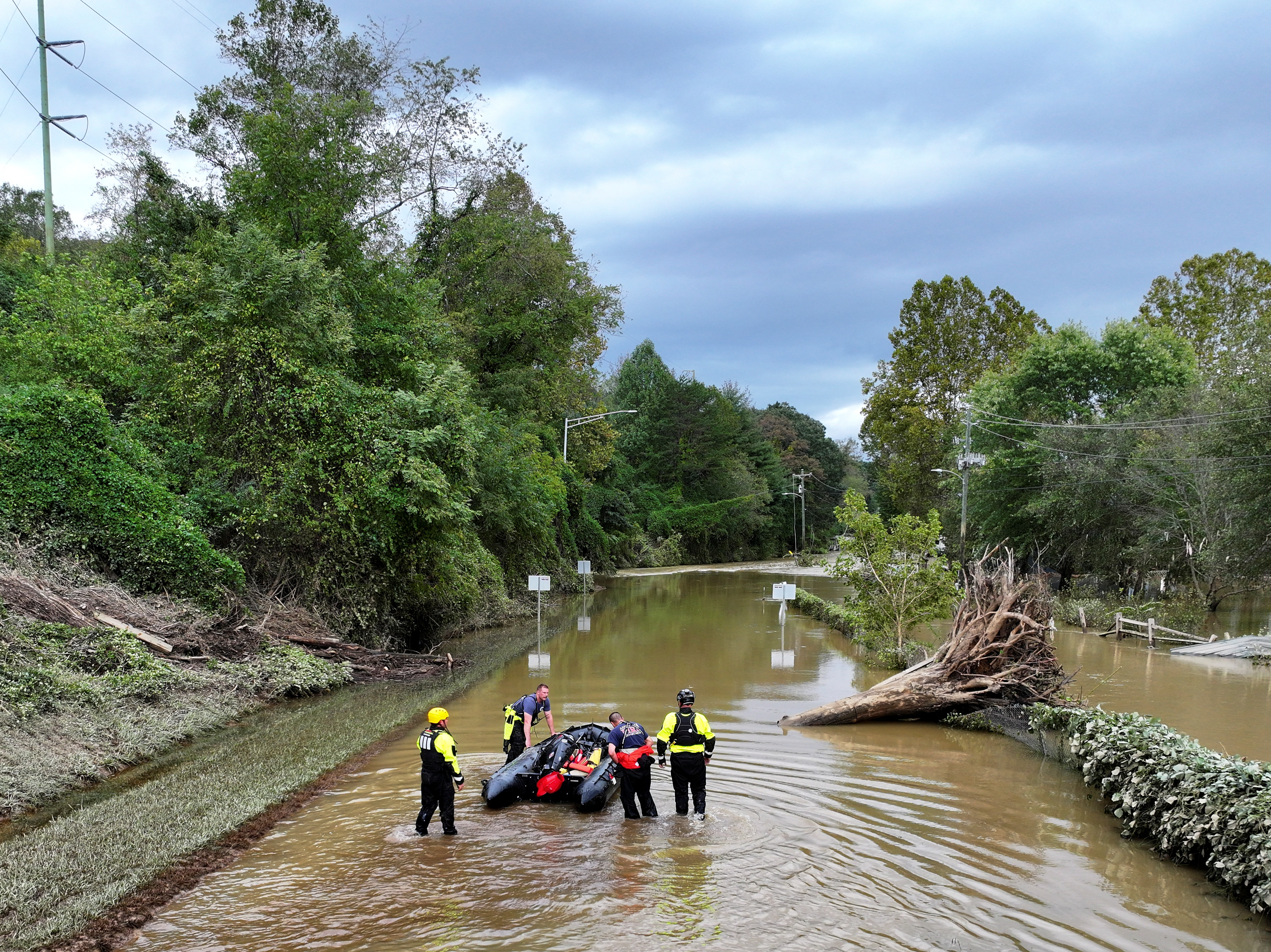 A drone view shows rescue personnel working in a flooded area, following the passage of Hurricane Helene, in Asheville, North Carolina