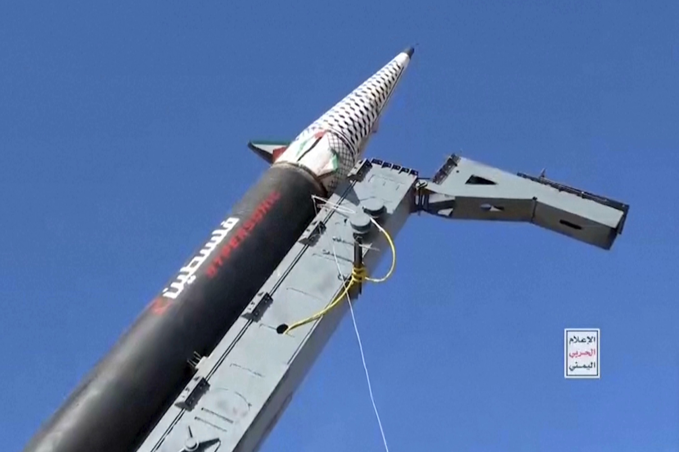 a missile against a blue sky