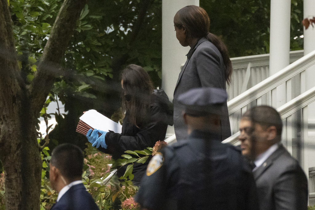 People exit Gracie Mansion, Adams’s official residence, on September 26 in New York City