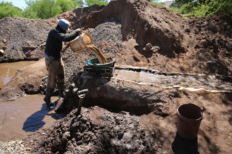 Small-scale miners search for gold in Kwekwe