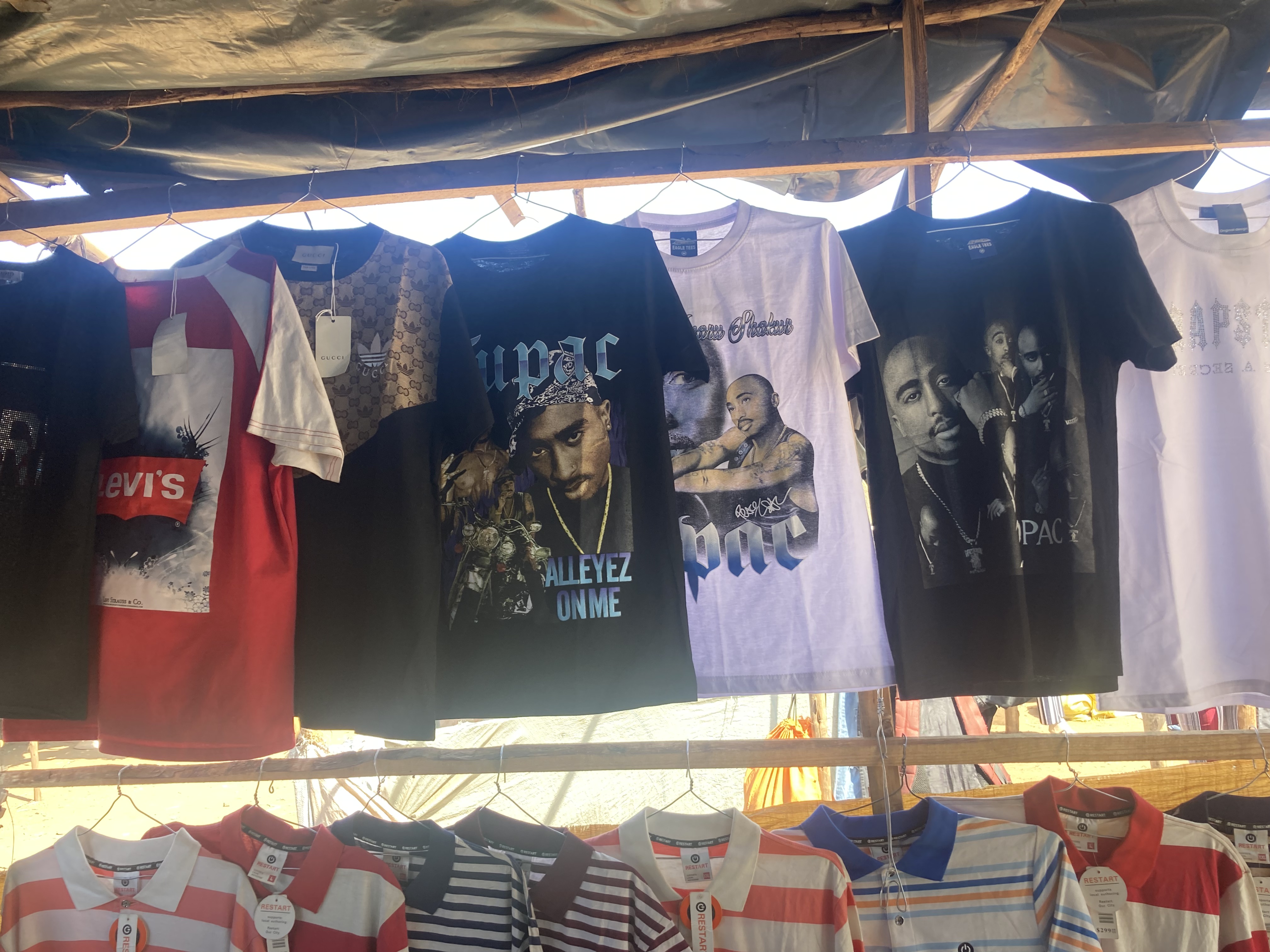 T-shirts and polos on display at Mbare market in Harare [Ish Mafundikwa]