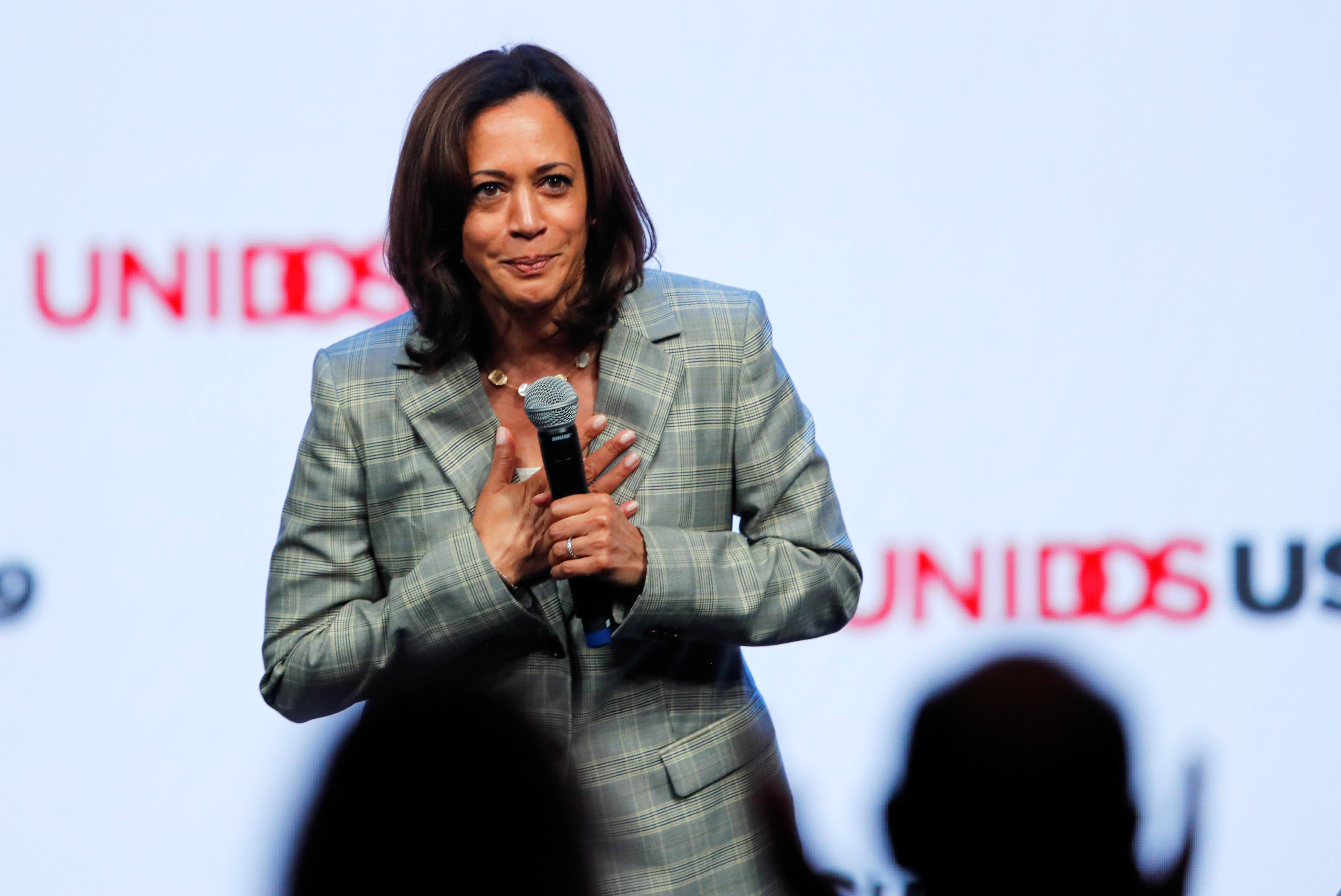 Democratic 2020 presidential candidate and U.S. Senator Kamala Harris bows to the crowd after speaking at the UnidosUS Annual Conference, in San Diego.
