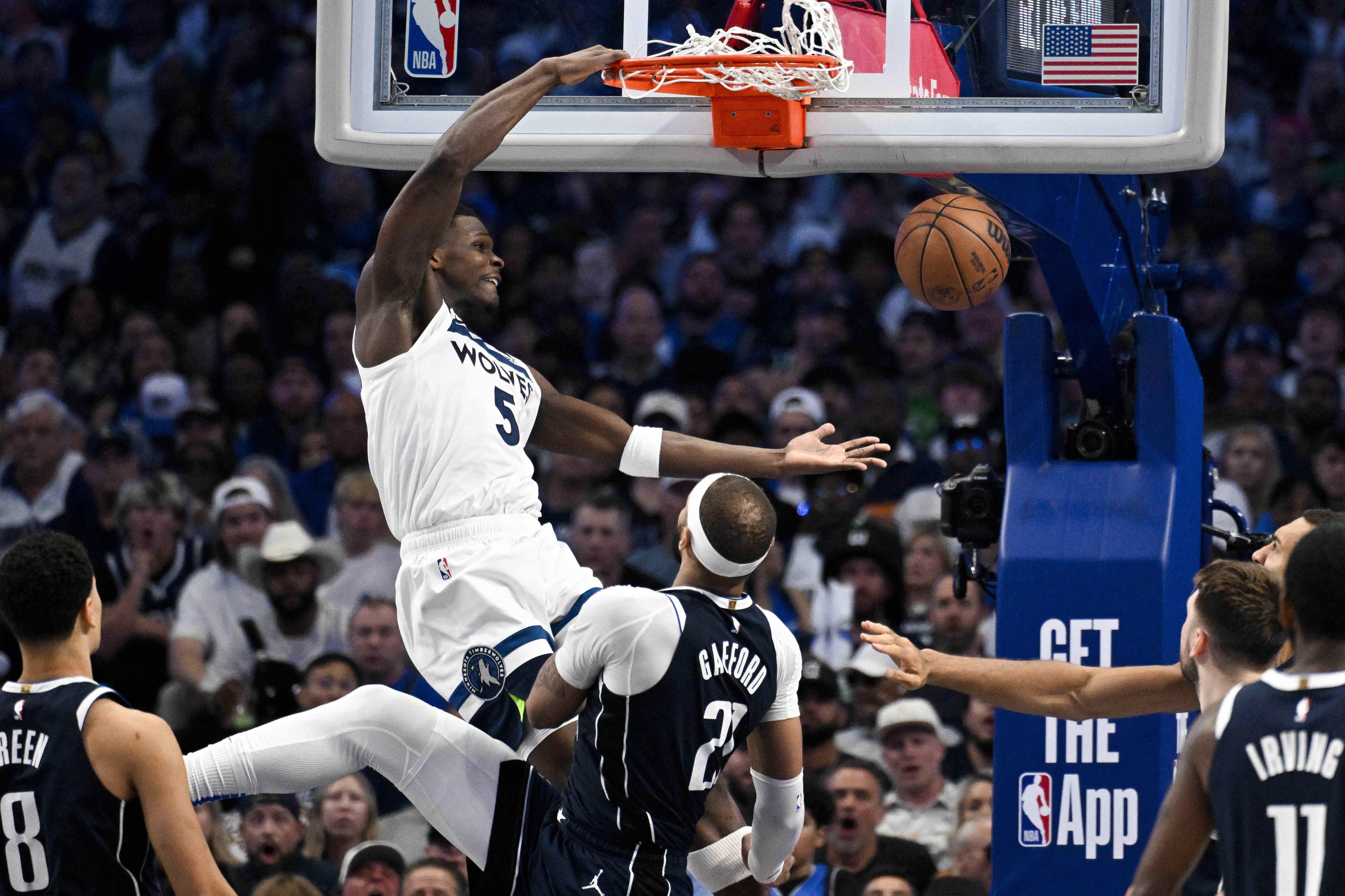 Minnesota Timberwolves guard Anthony Edwards #5 dunks the ball over Dallas Mavericks centre Daniel Gafford #21 during game three of the Western Conference finals for the 2024 NBA Playoffs