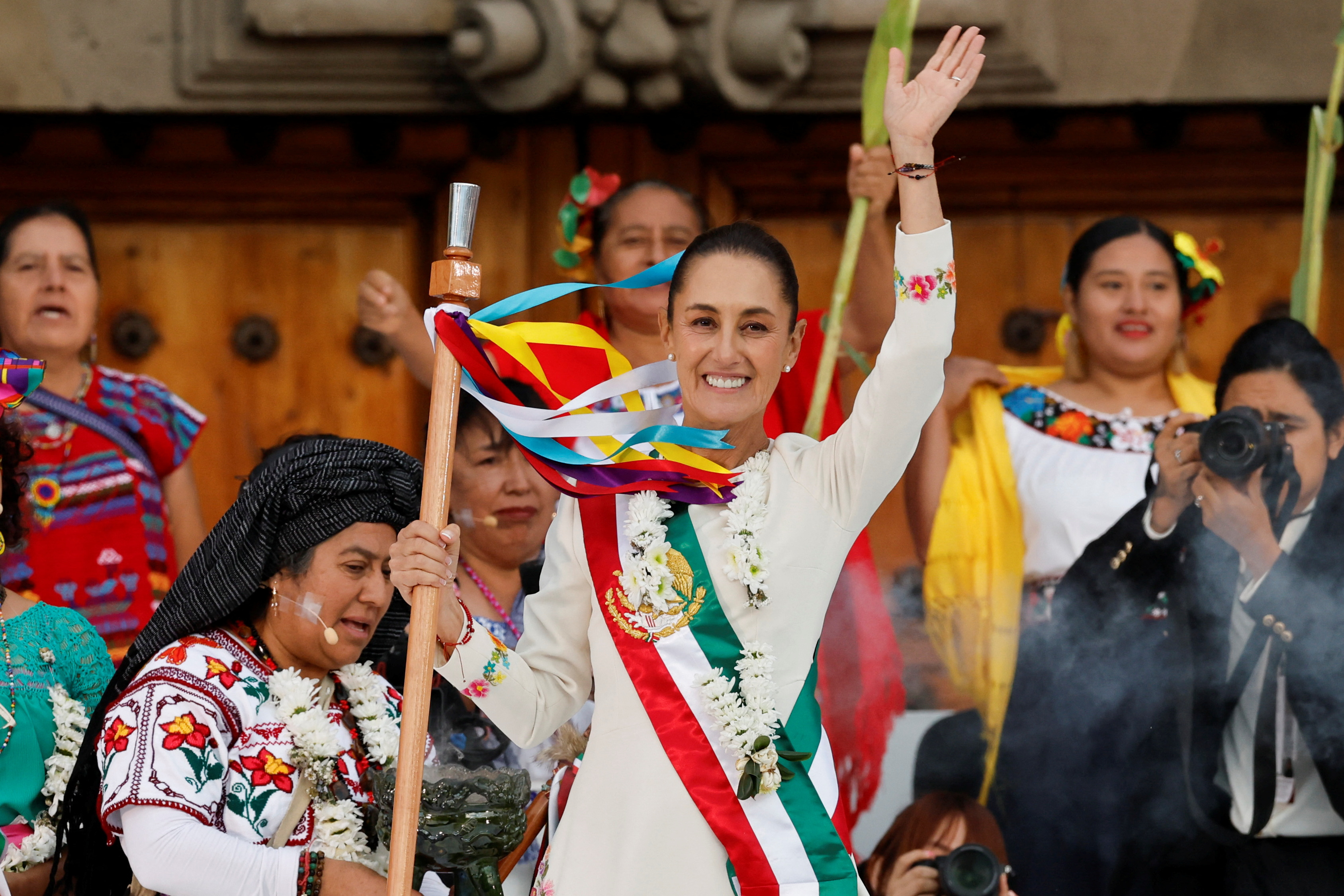 Mexico's new President Claudia Sheinbaum holds the 'baton of command' during a ceremony at Zocalo Square in Mexico City, Mexico October 1, 2024 [Daniel Becerril /Reuters]