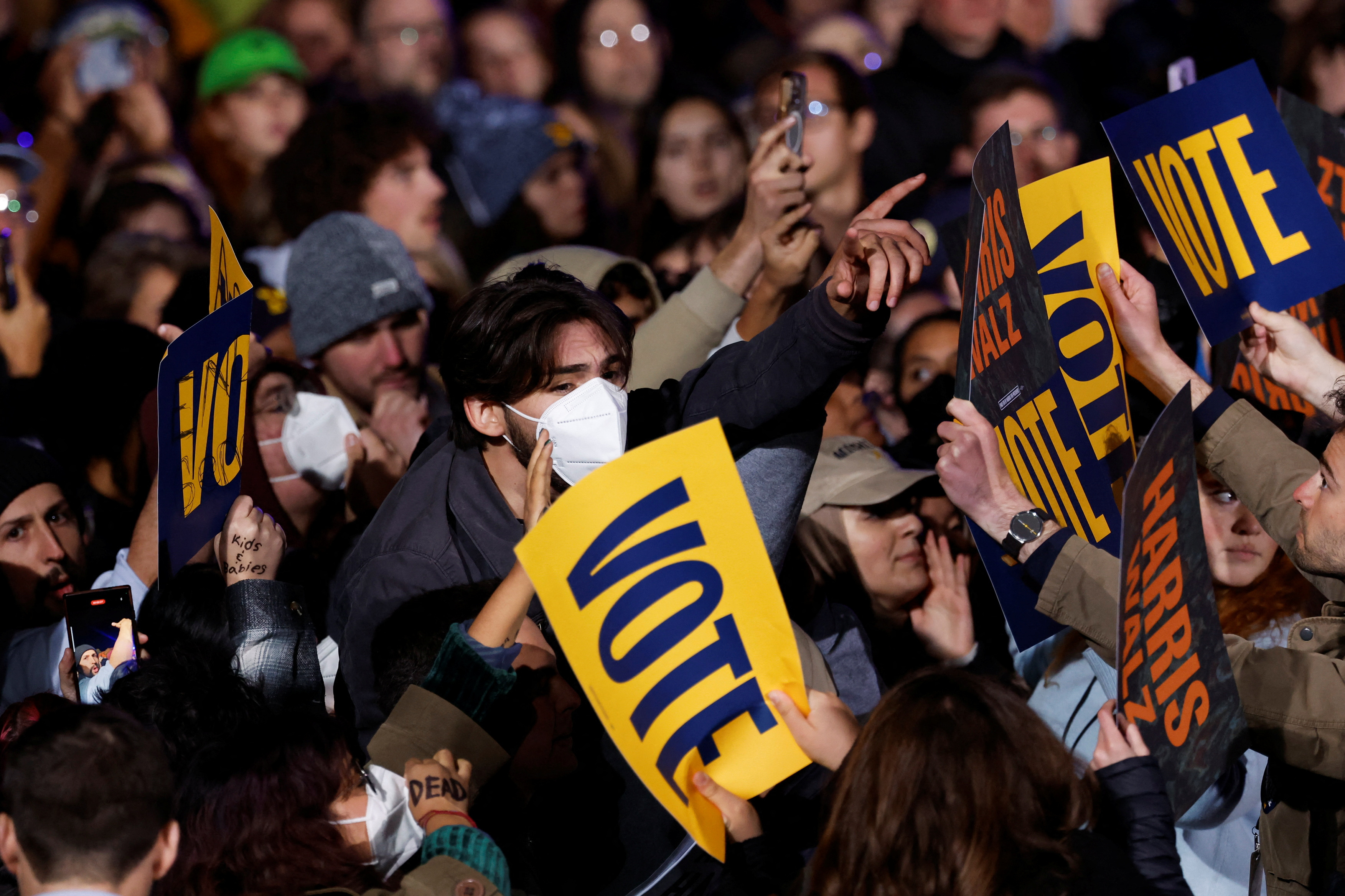 Demonstrators shout as Democratic presidential nominee US Vice President Kamala Harris holds a campaign rally and concert in Ann Arbor