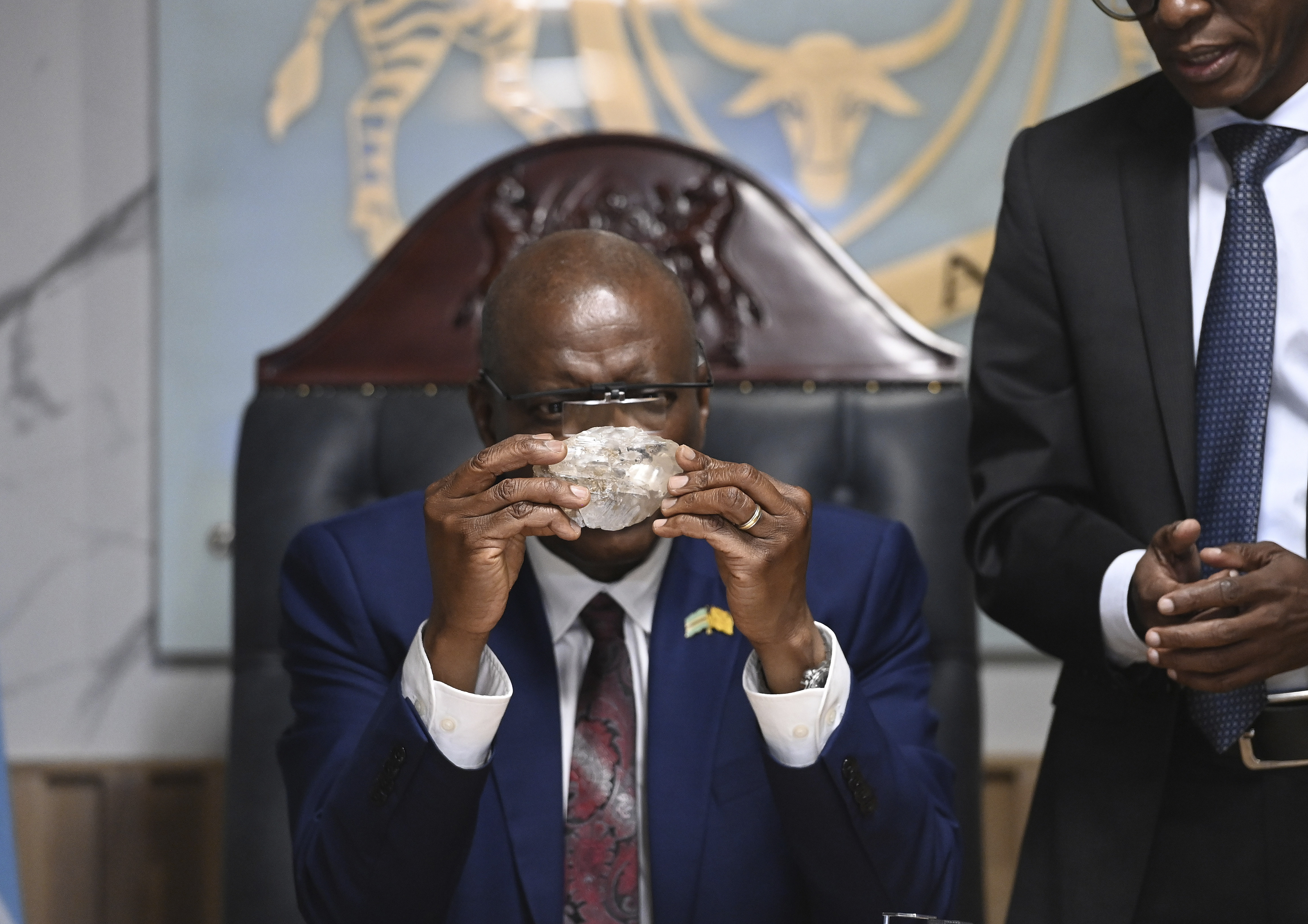 Botswana’s President Masisi holds a 2,492-carat diamond that was unearthed at one of its mines in August [AP Photo]